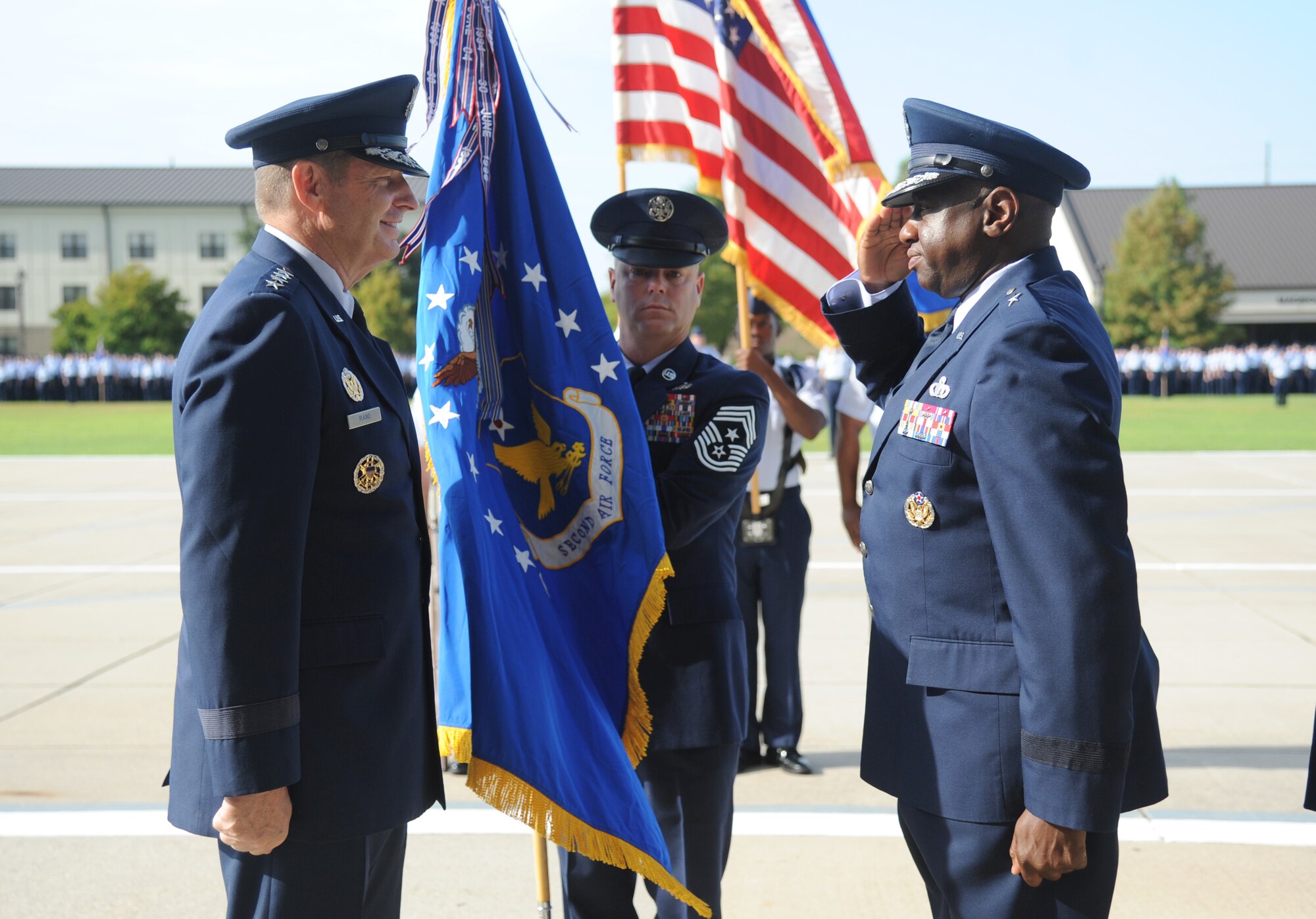 Brig. Gen. Mark Brown, incoming 2nd Air Force commander, renders a salute to Gen. Robin Rand, commander of Air Education and Training Command, after receiving the flag during the 2nd Air Force change of command ceremony July 3, 2014, at Keesler Air Force Base, Mississippi. Brown was previously the Financial Management director, Headquarters Air Force Material Command at Wright-Patterson Air Force Base, Ohio. He replaces Maj. Gen. Leonard Patrick, who's headed to Joint Base San Antonio-Randolph, Texas, where he will become the AETC vice commander. (U.S. Air Force photo by Kemberly Groue)