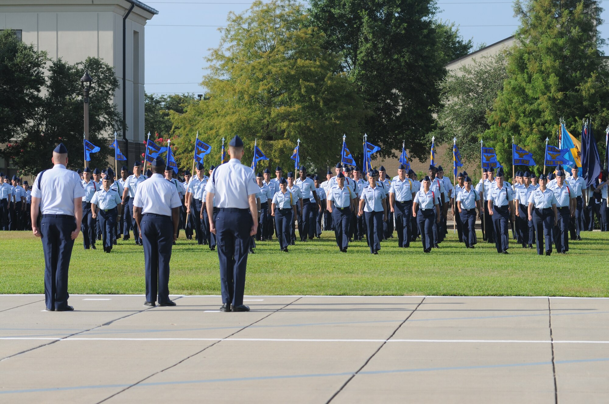Parade group officers march to the center of the parade field to salute the commander of troops at the 2nd Air Force change of command ceremony July 3, 2014, at Keesler Air Force Base, Mississippi. Brig. Gen. Mark Brown assumed command at the ceremony from Maj. Gen. Leonard Patrick. Brown was previously the Financial Management director, Headquarters Air Force Material Command at Wright-Patterson Air Force Base, Ohio. Patrick is headed to Joint Base San Antonio- Randolph, Texas, where he will become the AETC vice commander.  (U.S. Air Force photo by Kemberly Groue)