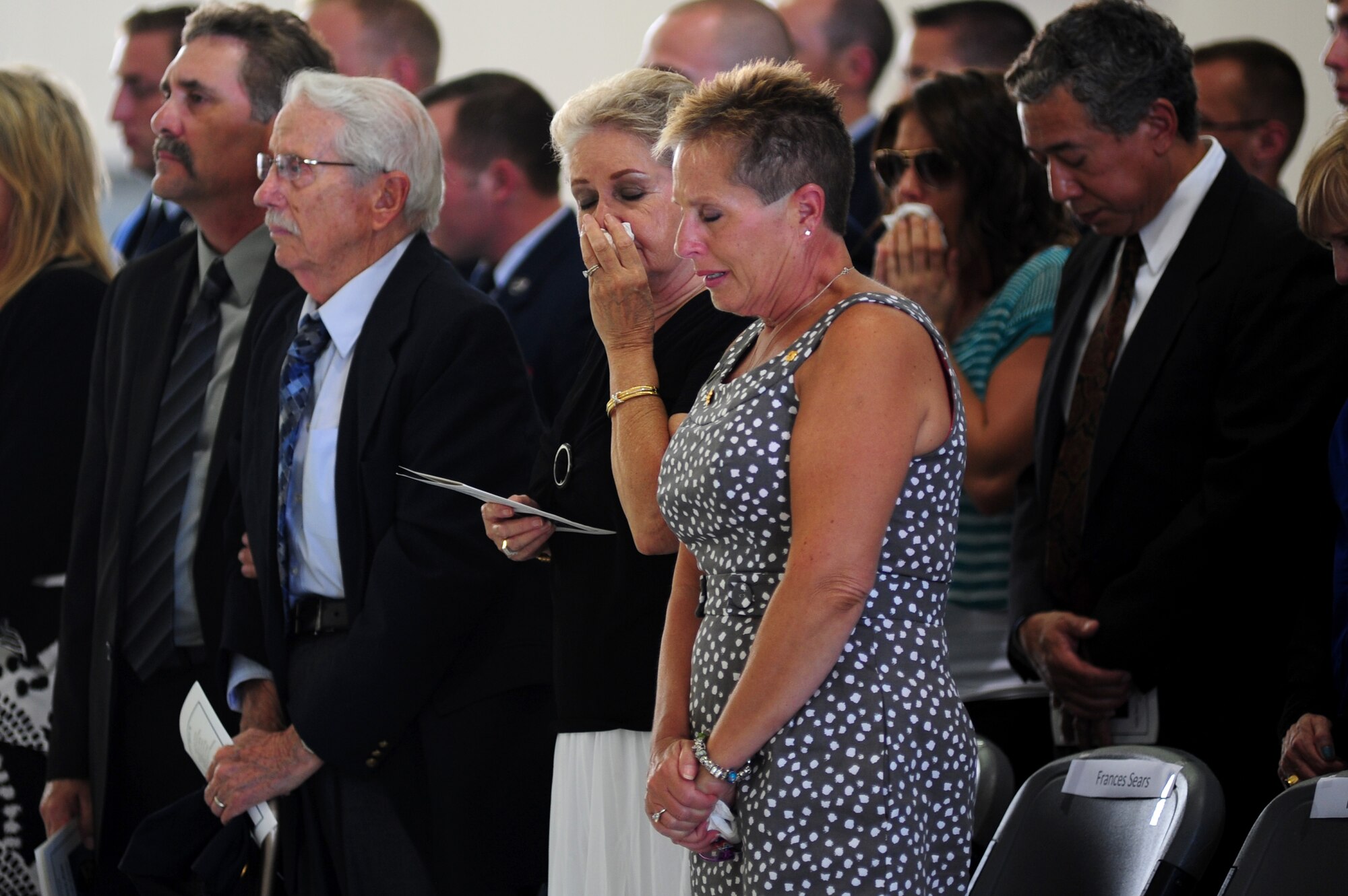 Family and friends mourn the passing of U.S. Air Force Senior Airman James Prine, during a memorial service at Langley Air Force Base, Va., July 3, 2014. Prine was a member of the 1st Aircraft Maintenance Squadron and a native of Newport News. He was 23 years old. (U.S. Air Force photo by Airman 1st Class Areca T. Wilson/Released) 