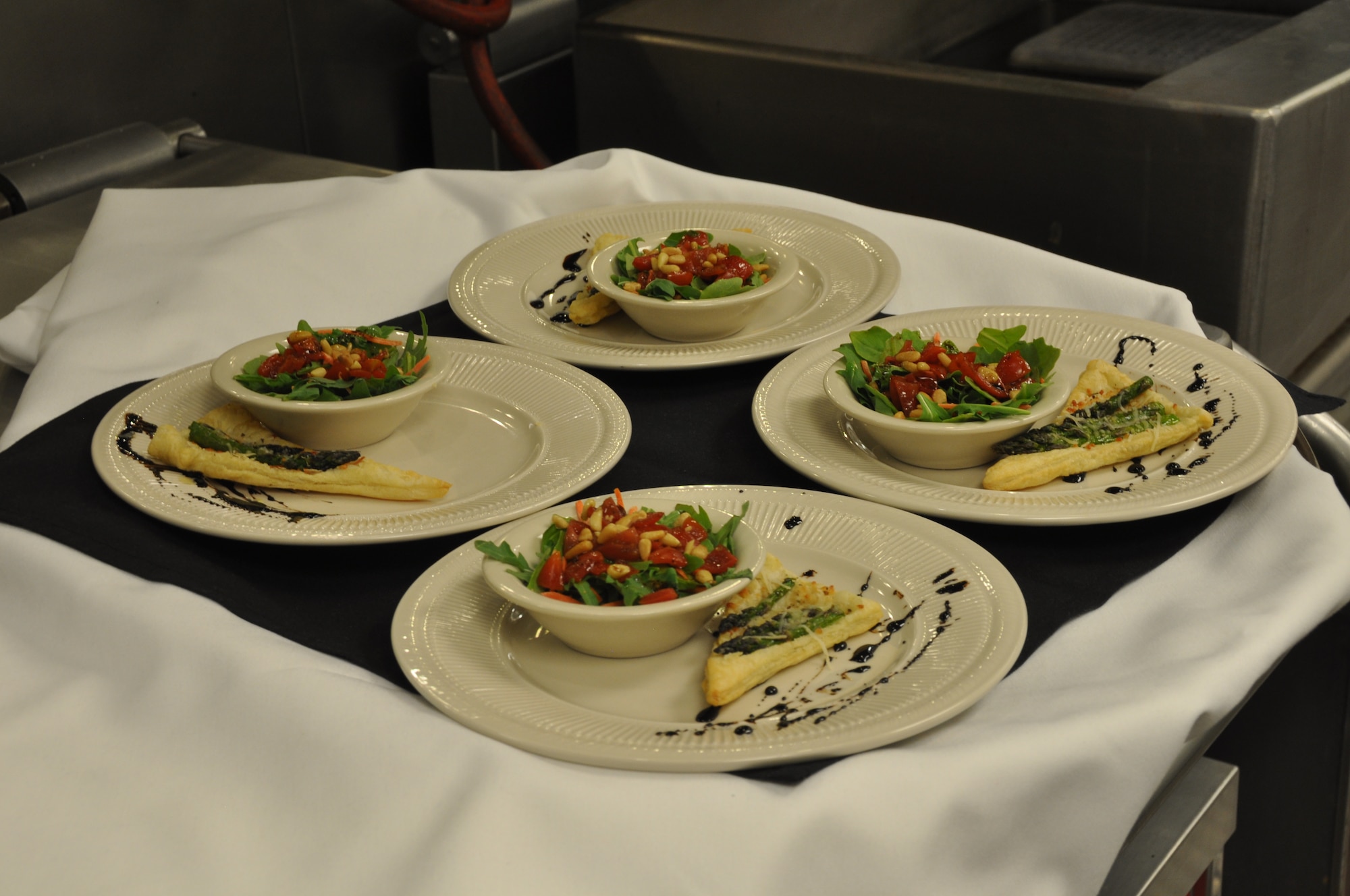 Asparagus appetizers await the four judges at the cooking competition at Fairchild Air Force Base, Washington, June 25, 2014. Asparagus was a mandatory component of each food item at the event. (U.S. Air Force photo by Staff Sgt. Robert Conniff/Released)