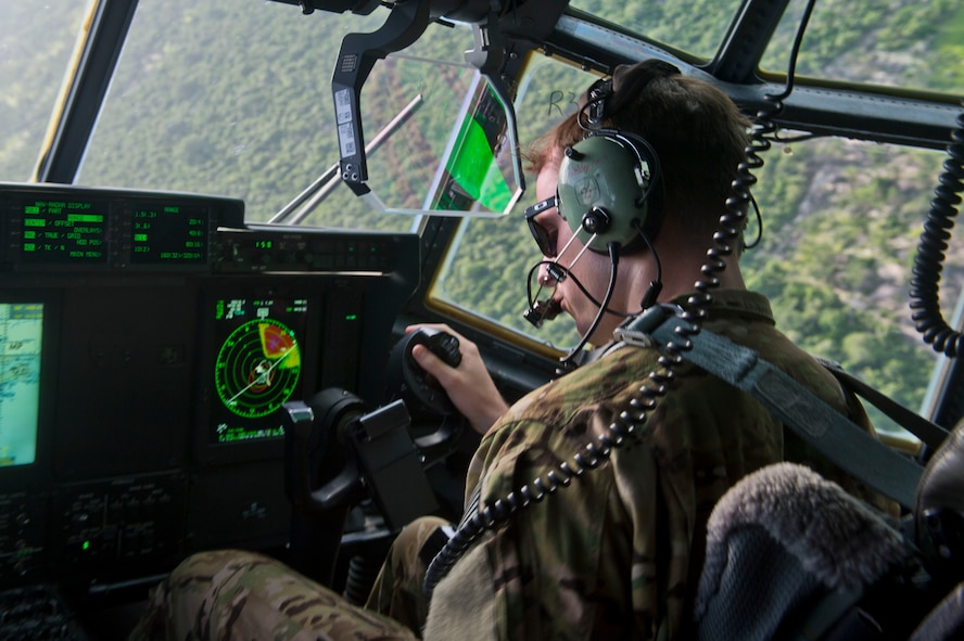 U.S. Air Force Capt. Eric May, 75th Expeditionary Airlift Squadron C-130J Super Hercules co-pilot, flies June 21, 2014, over East Africa. The C-130J crew was transporting personnel and equipment in support of Combined Joint Task Force-Horn of Africa's mission of stabilizing and strengthening security in East Africa. (U.S. Air Force photo by Senior Airman Riley Johnson)