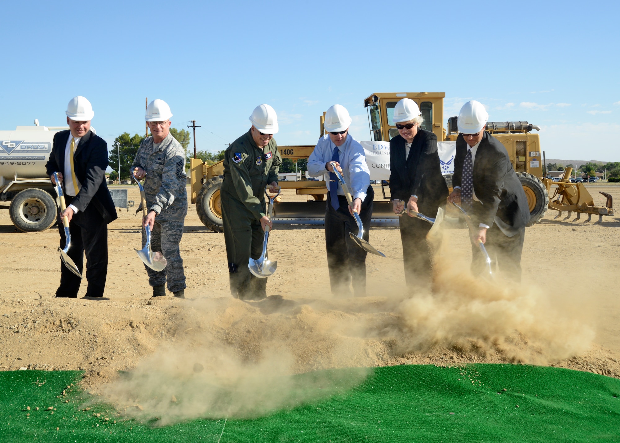 Breaking ground. From left: Heath Burleson, Corvias Military Living senior vice president and program director; Chief Master Sgt. Brian D. Randolph, 412th Test Wing command chief; Brig. Gen. Michael T. Brewer, 412th Test Wing commander; James Judkins, base civil engineer; Jeanette White, Housing Management Branch chief; J.C. Calder, Corvias Military Living program manager at Edwards AFB. The new community center is expected to be completed by Summer 2015. (U.S. Air Force photo by Kenji Thuloweit)
