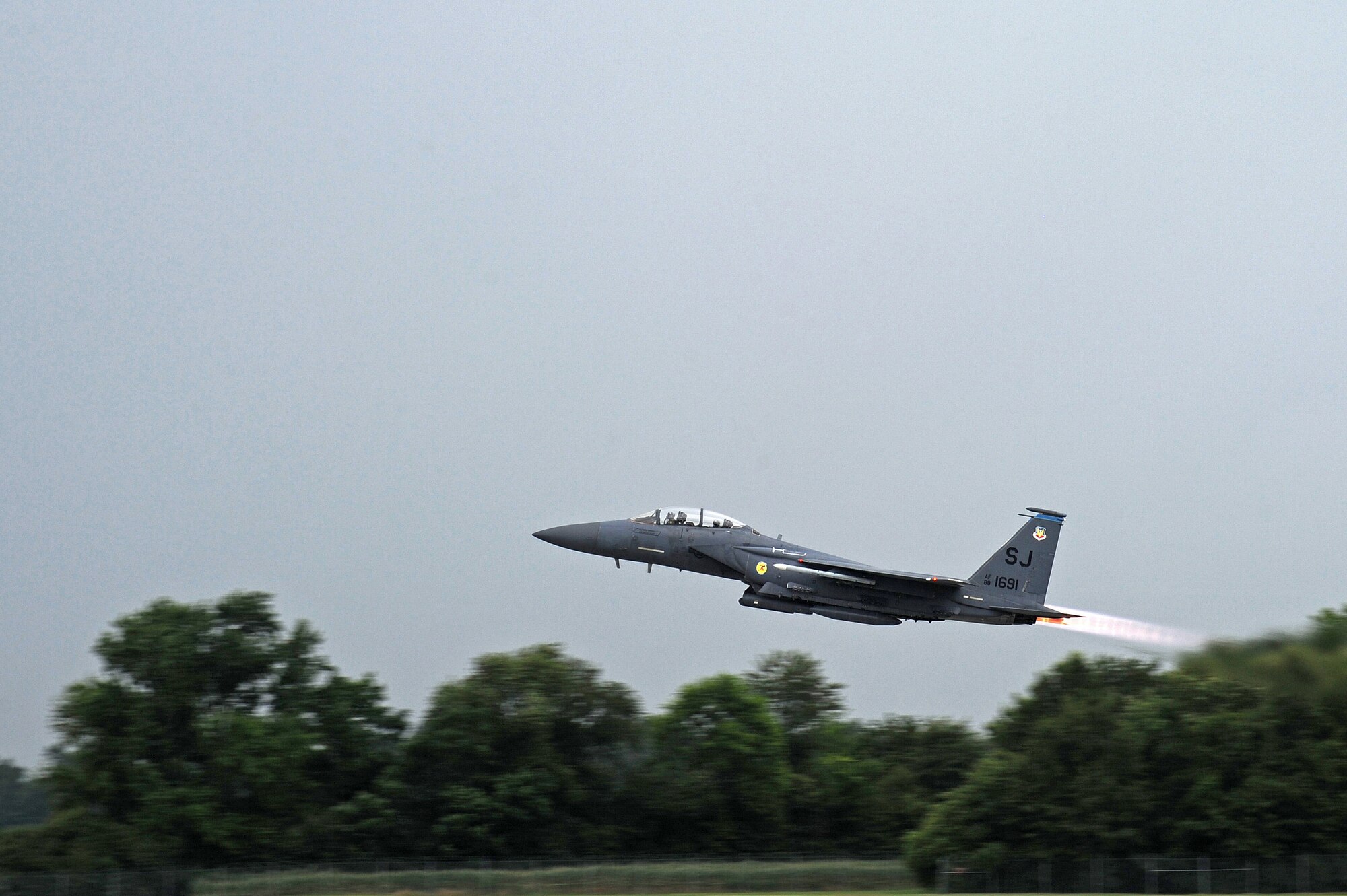 An F-15E Strike Eagle takes off July 3, 2014, at Seymour Johnson Air Force Base, N.C. More than 50 Strike Eagle aircraft were repositioned to Wright-Patterson Air Force Base, Ohio, as a precautionary measure to avoid potential damage from high winds associated with Hurricane Arthur. (U.S. Air Force photo/Airman 1st Class Aaron J. Jenne)