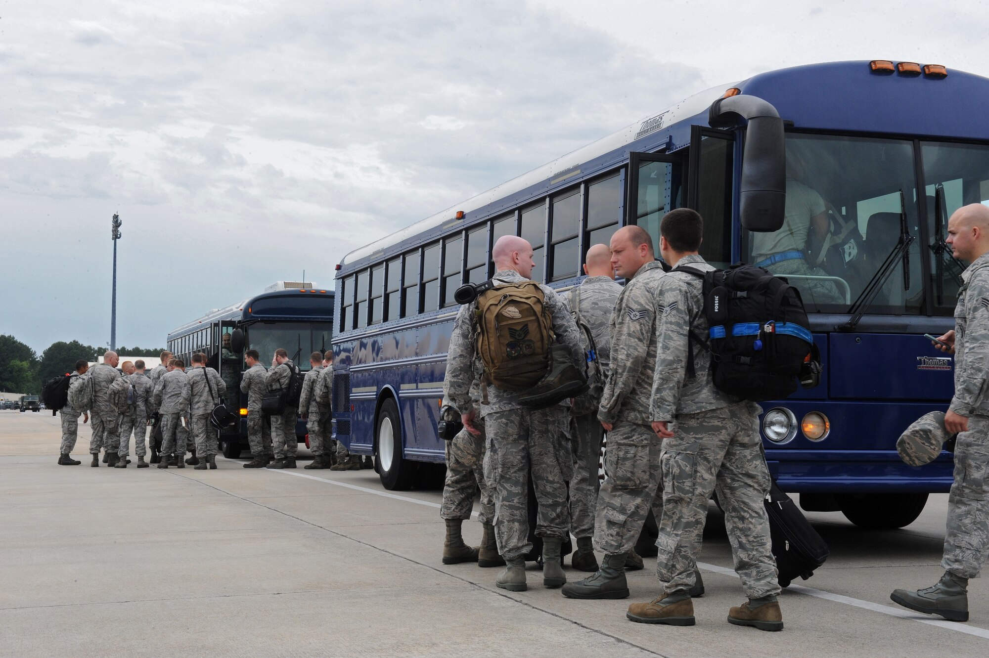 Airmen assigned to the 4th Aircraft Maintenance Squadron board busses headed toward a KC-135R Stratotanker aircraft, which would carry them to Wright-Patterson Air Force Base, Ohio, July 3, 2014, at Seymour Johnson Air Force Base, North Carolina. More than 50 Strike Eagle aircraft were repositioned to Wright-Patterson AFB, Ohio, as a precautionary measure to avoid potential damage from high winds associated with Hurricane Arthur. (U.S. Air Force photo/Airman 1st Class Aaron J. Jenne)