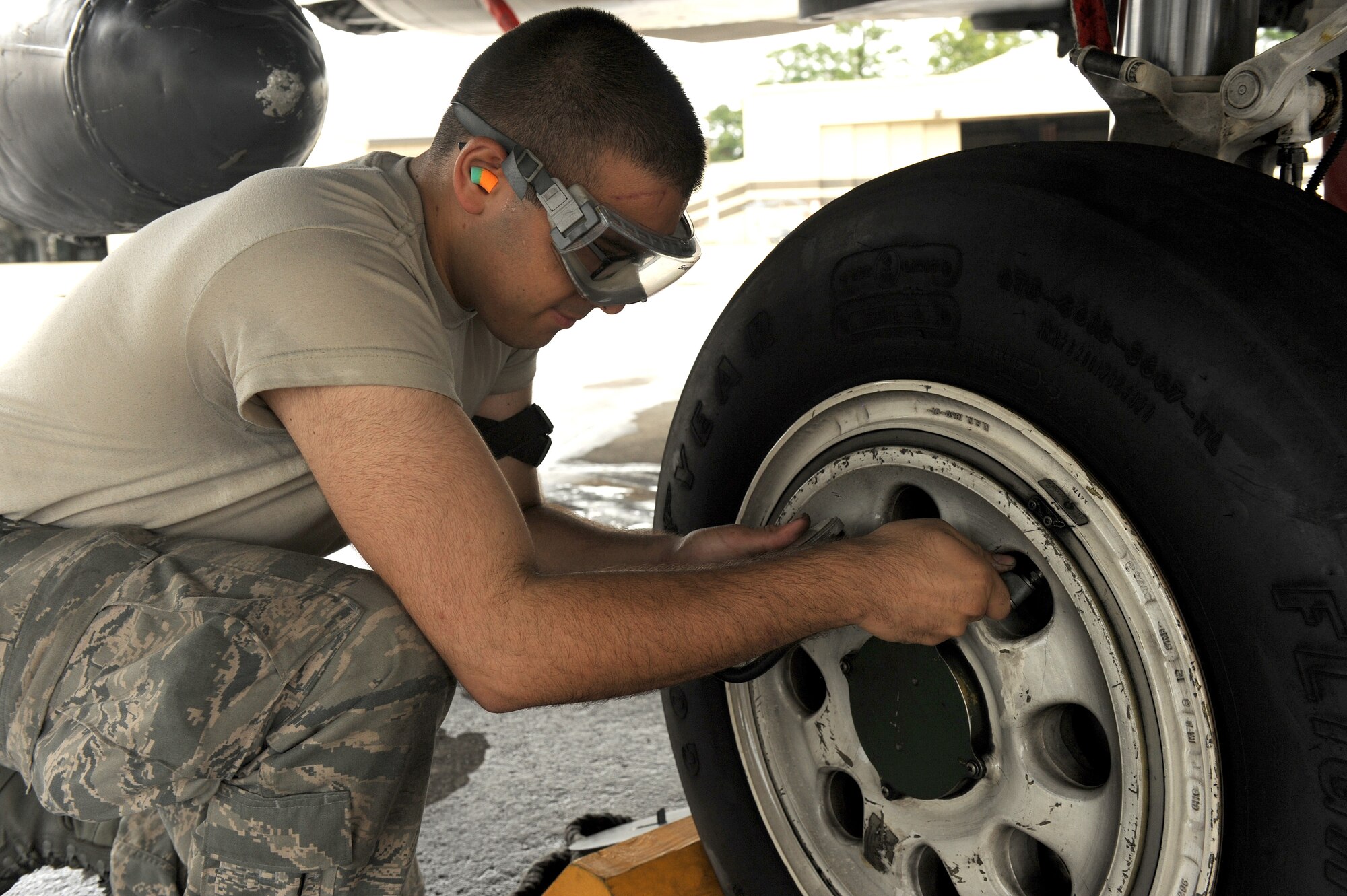 Airman 1st Class Daniel Guerrero, 4th Aircraft Maintenance Squadron crew chief, checks the tire pressure of an F-15E Strike Eagle aircraft July 3, 2014, at Seymour Johnson Air Force Base, North Carolina. More than 50 Strike Eagle aircraft were repositioned to Wright-Patterson Air Force Base, Ohio, as a precautionary measure to avoid potential damage from high winds associated with Hurricane Arthur. (U.S. Air Force photo/Airman 1st Class Aaron J. Jenne)