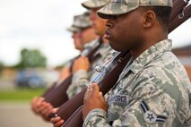 Members of the Minot Air Force Base Honor practice ceremonial rifle techniques June 20, 2014. Practice is crucial to ensure synchronized required precision  for ceremonial drills. (U.S. Air Force photo/Senior Airman Brittany Y. Bateman)