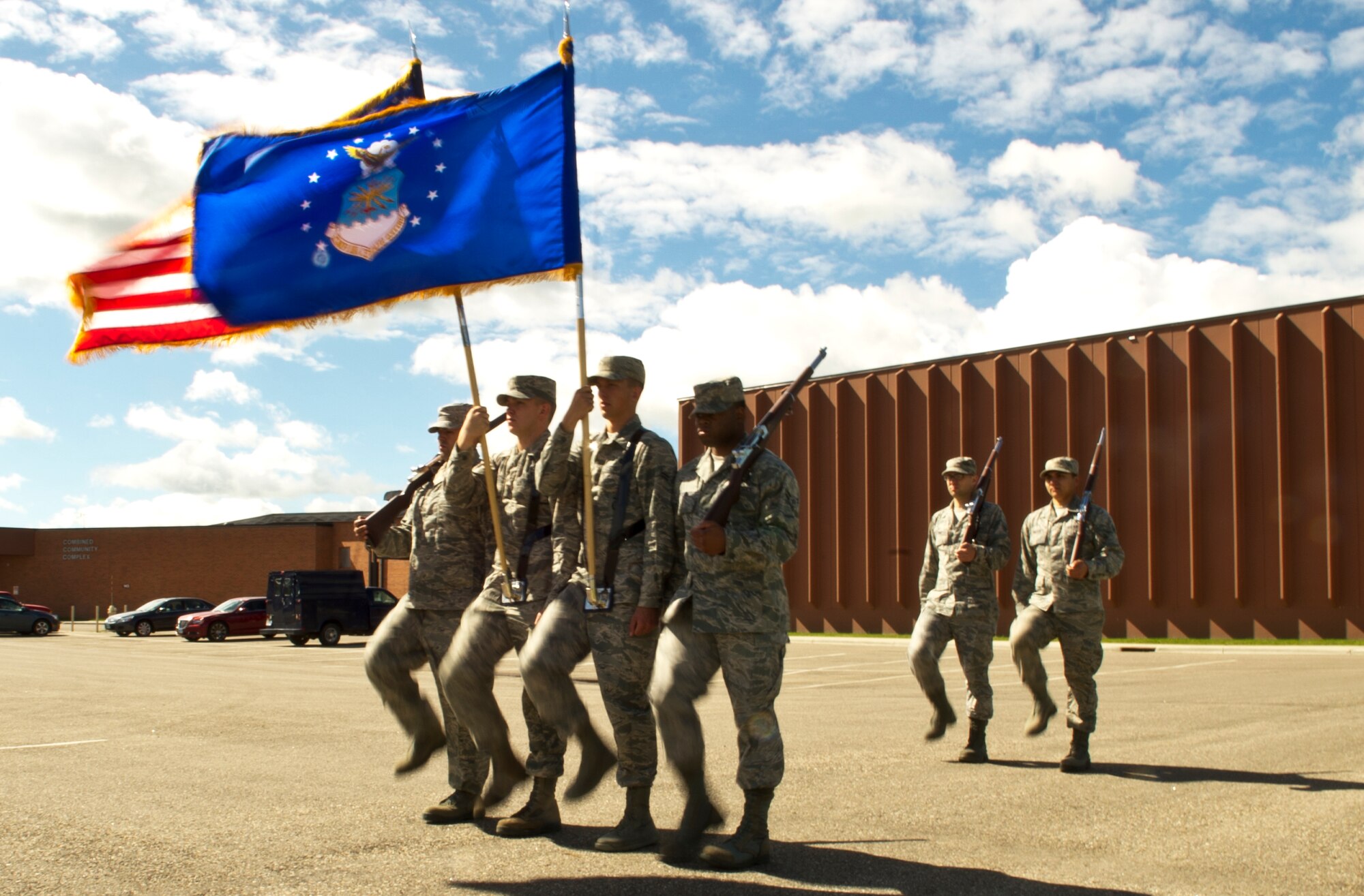 Members of the Minot Air Force Base Honor Guard present the colors during practice June 20, 2014. The Minot AFB Honor Guard provides a distinct mission under unique conditions. Their mission includes performing military honors and presenting colors throughout North Dakota and on base. (U.S. Air Force photo/Senior Airman Brittany Y. Bateman)