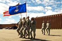 Members of the Minot Air Force Base Honor Guard present the colors during practice June 20, 2014. The Minot AFB Honor Guard provides a distinct mission under unique conditions. Their mission includes performing military honors and presenting colors throughout North Dakota and on base. (U.S. Air Force photo/Senior Airman Brittany Y. Bateman)