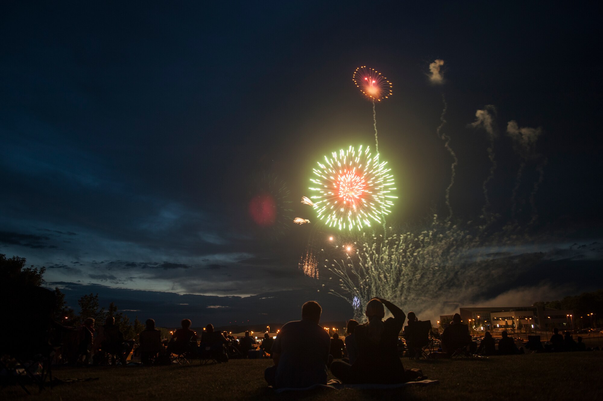 People watch a fireworks display during Super Saber Appreciation Day July 4, 2014, at Spangdahlem Air Base, Germany. The fireworks display ended the event, which aimed at giving back to the community and celebrating Independence Day. (U.S. Air Force photo by Senior Airman Rusty Frank/Released)