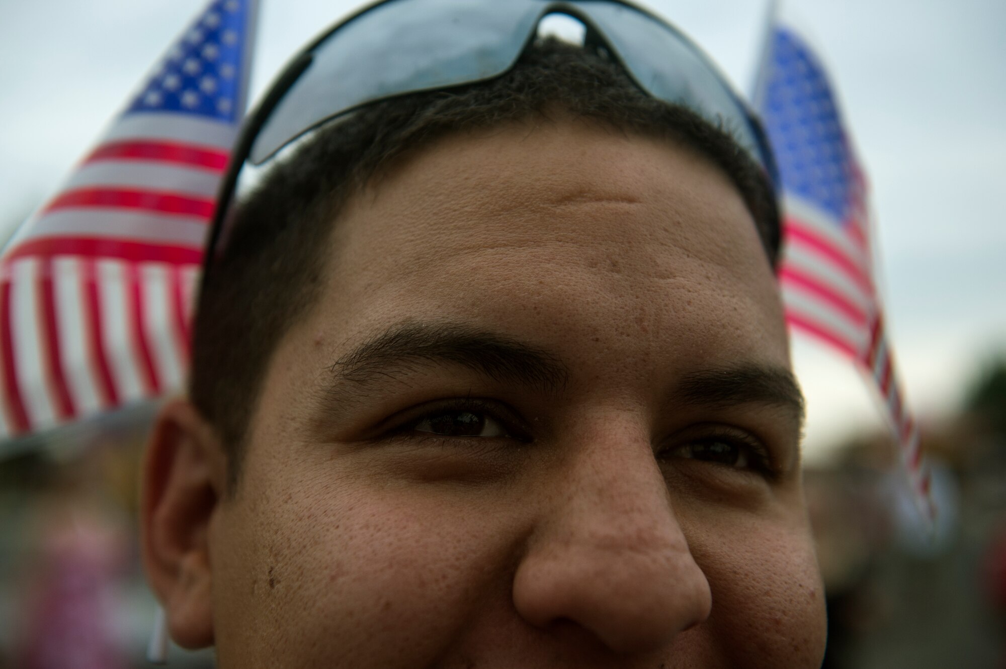 U.S. Air Force Staff Sgt. Phillip Fox, a 52nd Security Forces Squadron desk sergeant from Burnet, Texas, watches his children as they get on a swing during Super Saber Appreciation Day July 4, 2014, at Spangdahlem Air Base, Germany. During the event there were several activities that families could enjoy. (U.S. Air Force photo by Senior Airman Rusty Frank/Released)