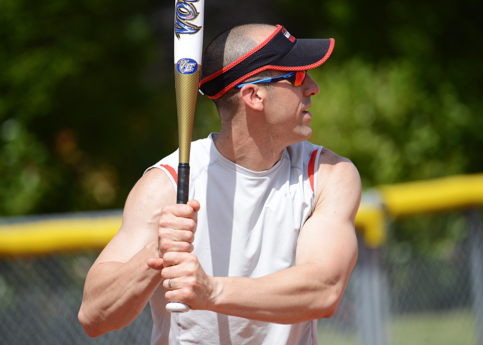 Lt. Col. Damian Schlussel, 31st Security Forces commander, prepares to hit a softball during the Chiefs vs. Eagles game, July, 4, 2014, at Aviano Air Base, Italy. The chiefs and first sergeants teamed up to play against base leadership in softball for bragging rights. The Eagles defeated the Chiefs, 8 to 4. (U.S. Air Force photo/Airman 1st Class Deana Heitzman)