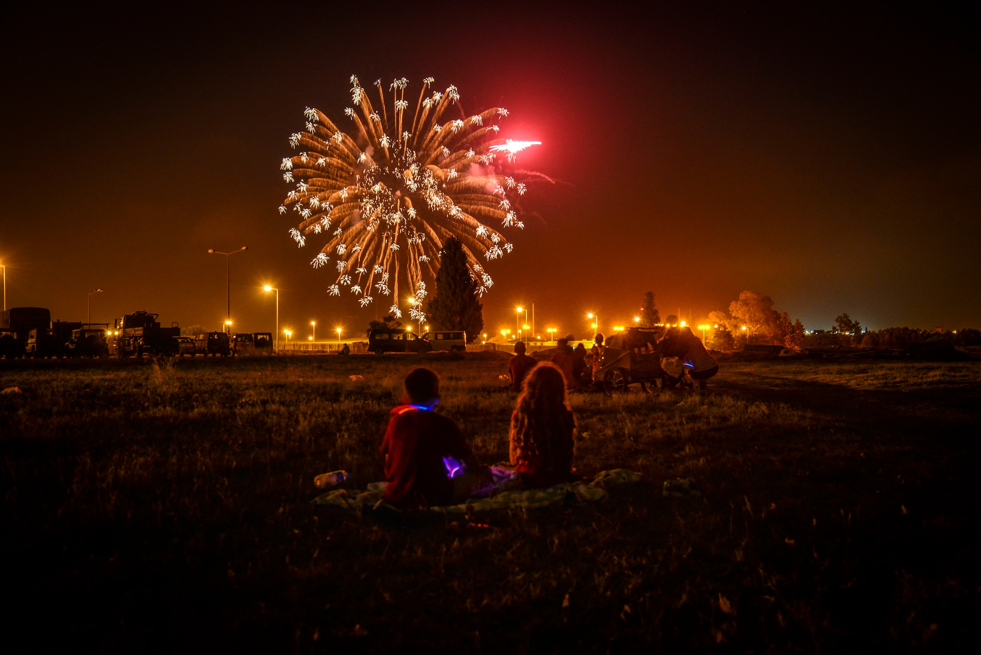 Children watch a fireworks display at the Independence Day celebration July 4, 2014,  Incirlik Air Base, Turkey.  There were approximately 400 Airmen and family members in attendance at the event which was coordinated by the 39th Force Support Squadron. (U.S. Air Force photo by Senior Airman Nicole Sikorski/Released) 