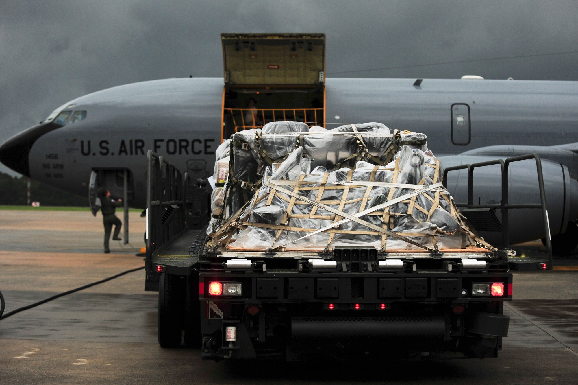 Airmen prepare to load a KC-135R Stratotanker with maintenance pallets, July 3, 2014 at Seymour Johnson Air Force Base, North Carolina. More than 50 F-15E Strike Eagles and four KC-135R Stratotanker aircraft were repositioned to Wright-Patterson Air Force Base, Ohio, as a precautionary measure to avoid potential damage from high winds associated with Hurricane Arthur. (U.S. Air Force photo/Airman 1st Class Brittain Crolley)