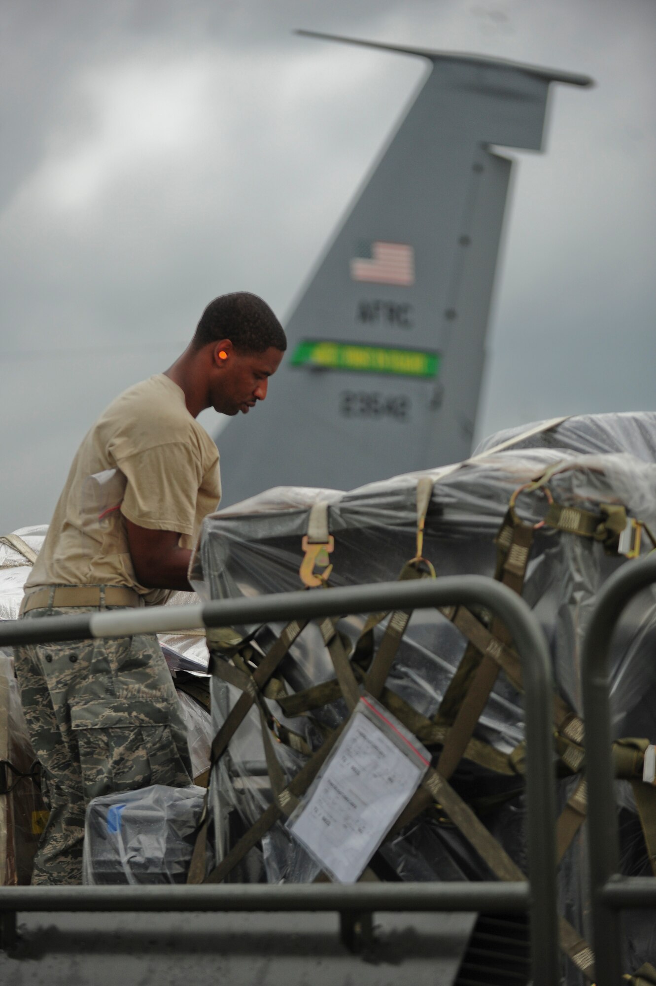 Tech. Sgt. Chester Moore, 4th Logistics Readiness Squadron NCO in charge of air terminal operations, conducts a final inspection of a pallet, July 3, 2014 at Seymour Johnson Air Force Base, North Carolina. More than 50 F-15E Strike Eagles and four KC-135R Stratotanker aircraft were repositioned to Wright-Patterson Air Force Base, Ohio, as a precautionary measure to avoid potential damage from high winds associated with Hurricane Arthur. (U.S. Air Force photo/Airman 1st Class Brittain Crolley)