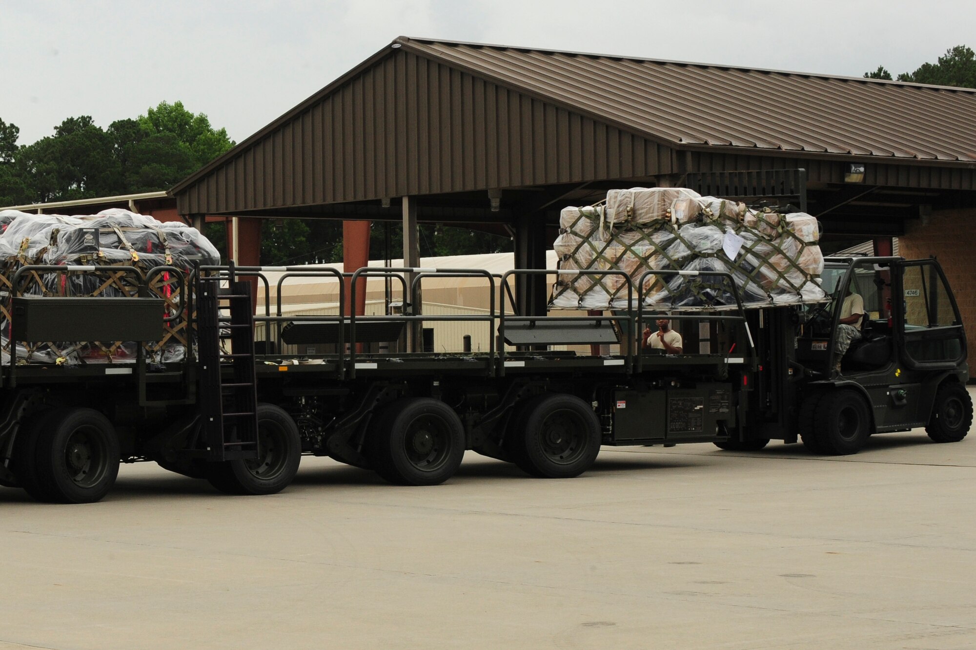 Tech. Sgt. Chester Moore, 4th Logistics Readiness Squadron NCO in charge of air terminal operations, loads a truck with pallets of maintenance equipment, July 3, 2014, at Seymour Johnson Air Force Base, North Carolina. More than 50 F-15E Strike Eagles and four KC-135R Stratotanker aircraft were repositioned to Wright-Patterson Air Force Base, Ohio, as a precautionary measure to avoid potential damage from high winds associated with Hurricane Arthur. (U.S. Air Force photo/Airman 1st Class Brittain Crolley)