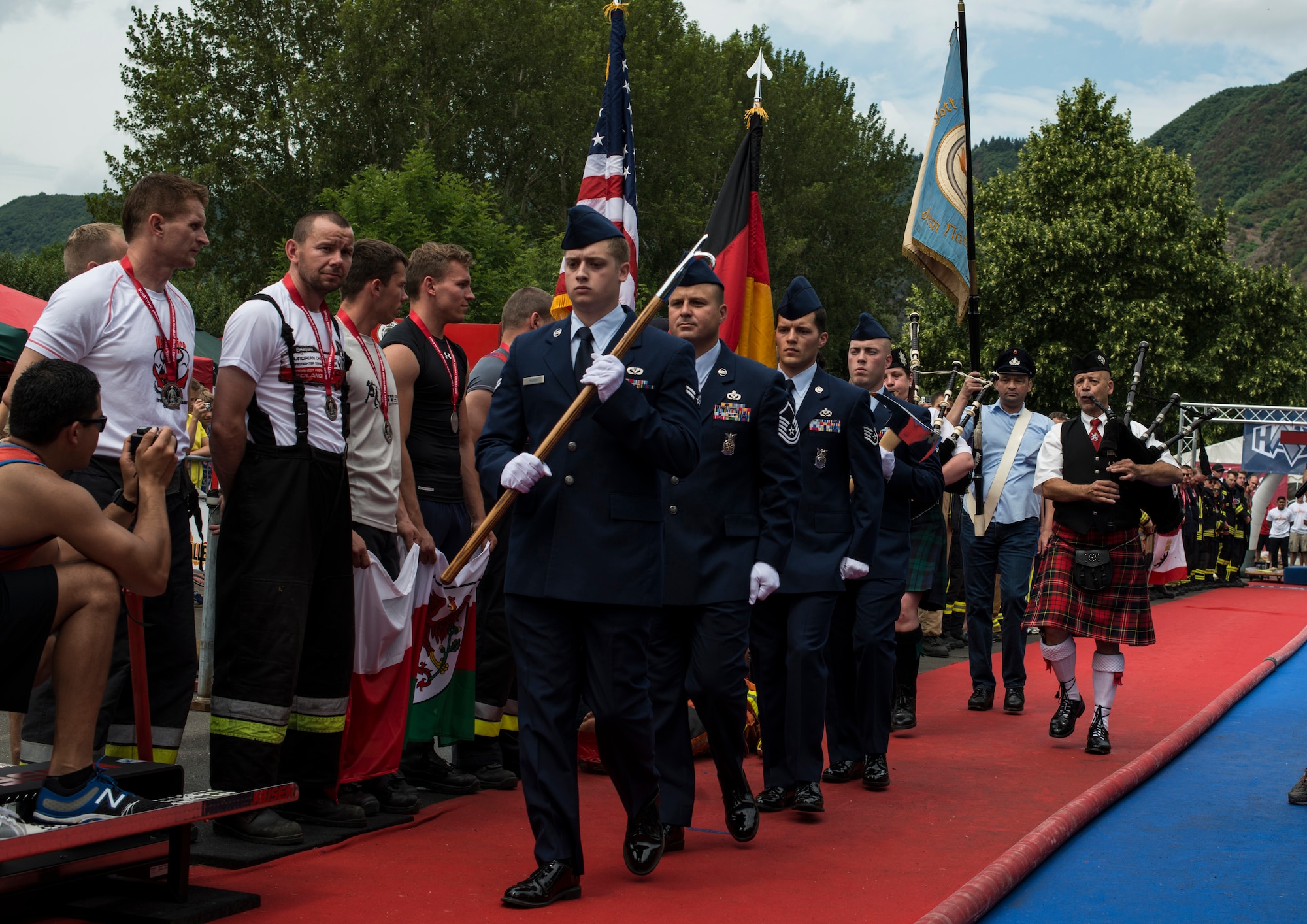 Spangdahlem Air Base honor guard members present the colors during the first Mosel Firefighter Combat Challenge opening ceremony at Ediger-Eller, Germany, July 6, 2014. More than 200 firefighters from across Europe participated in the challenge. (U.S. Air Force photo by Staff Sgt. Christopher Ruano/Released)