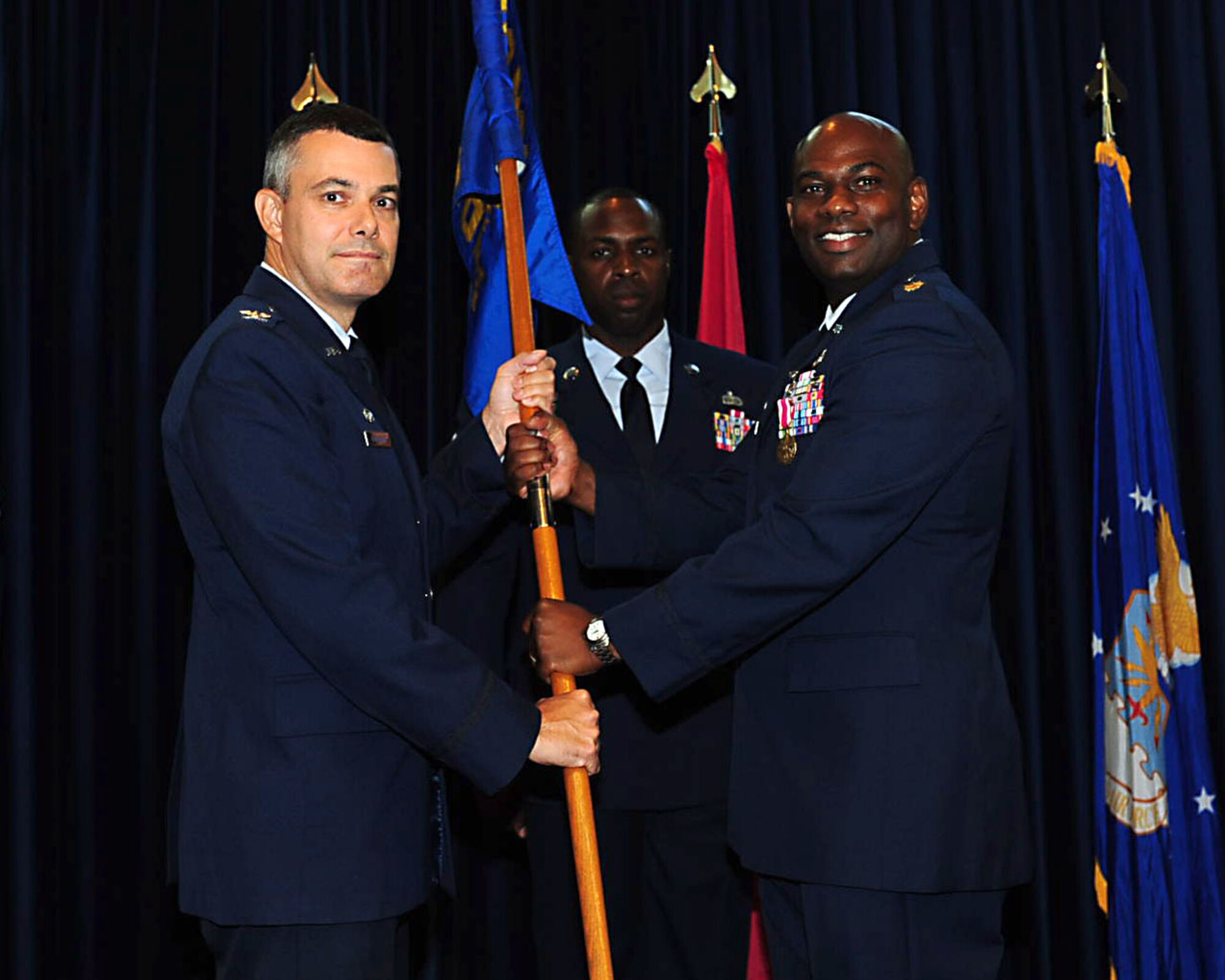 Maj. Wardrias Little reliquishes command of the 39th Contracting Squadron to Col. Sean T. Gallagher, 39th Mission Support Group commander, July 8, 2014, Incirlik Air Base, Turkey. Wardrias will continue his Air Force career at Maxwell Air Force Base, Ala. (U.S. Air Force photo by Staff Sgt. Eboni Reams/Released)