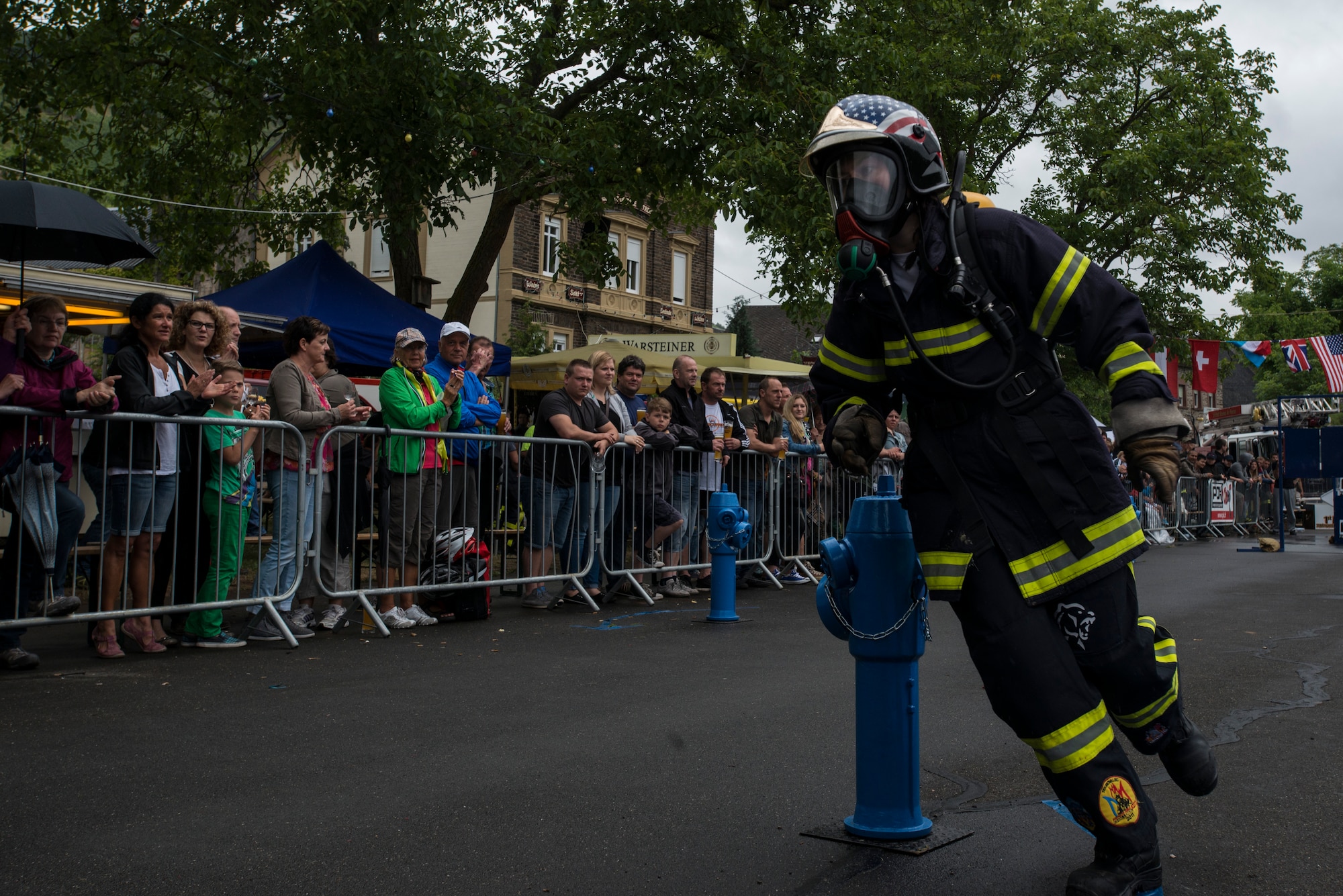 Beachtel Annaelle, a firefighter from Strasbourg, France, runs the obstacle course during the first Mosel Firefighter Combat Challenge in Ediger-Eller, Germany, July 5, 2014. Firefighters from more than nine countries in Europe participated in the challenge. (U.S. Air Force photo by Staff Sgt. Christopher Ruano/Released)