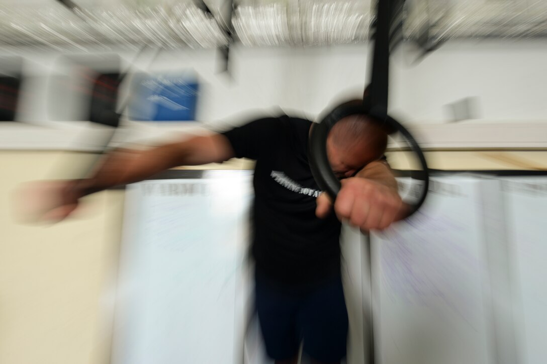 U.S. Air Force Master Sgt. Donald Stichter, 52nd Equipment Maintenance Squadron NCO in charge of munitions inspection from Lakewood, Colo., rests during a combat fitness workout May 5, 2014, at Spangdahlem Air Base, Germany. Stichter used combat fitness to train for his first marathon. (U.S. Air Force photo by Senior Airman Rusty Frank/Released)