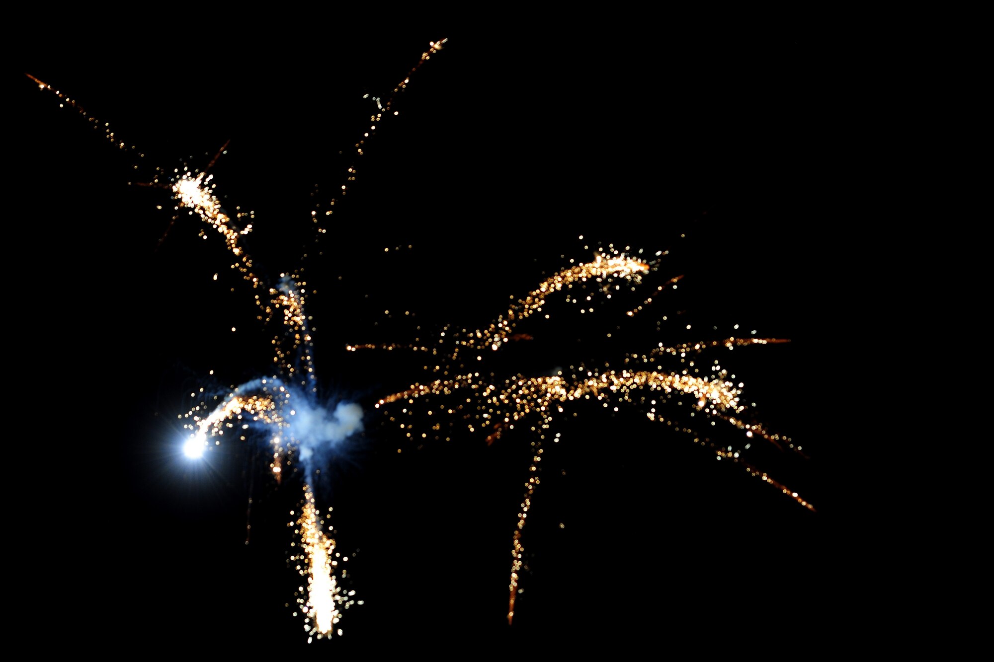 A firework explodes in the sky over RAF Alconbury, United Kingdom, July 3, 2014. The fireworks show was part of the Independence Day celebration hosted by the 501st Combat Support Wing. (U.S. Air Force photo by Staff Sgt. Jarad A. Denton/Released)