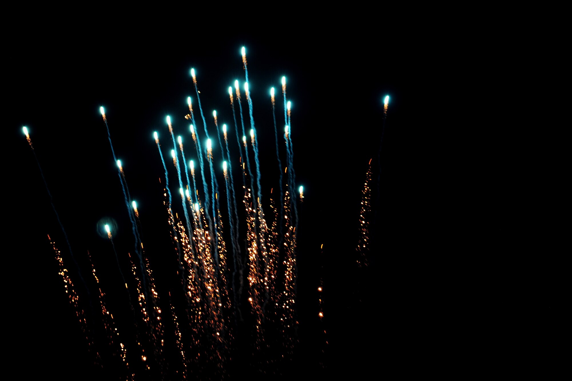 A firework explodes in the sky over RAF Alconbury, United Kingdom, July 3, 2014. The fireworks show was part of the Independence Day celebration hosted by the 501st Combat Support Wing. (U.S. Air Force photo by Staff Sgt. Jarad A. Denton/Released)