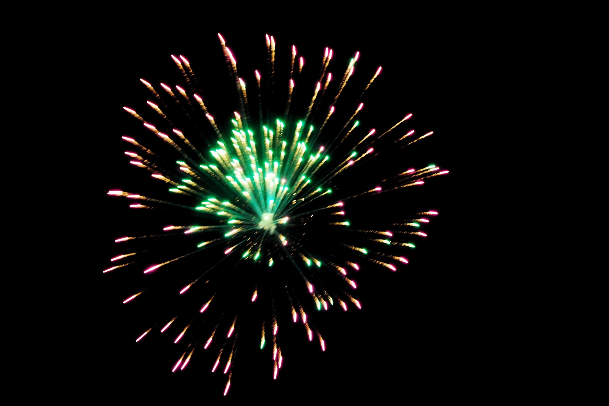 A firework explodes in the sky over RAF Alconbury, United Kingdom, July 3, 2014. The fireworks show was part of the Independence Day celebration hosted by the 501st Combat Support Wing. (U.S. Air Force photo by Staff Sgt. Jarad A. Denton/Released)