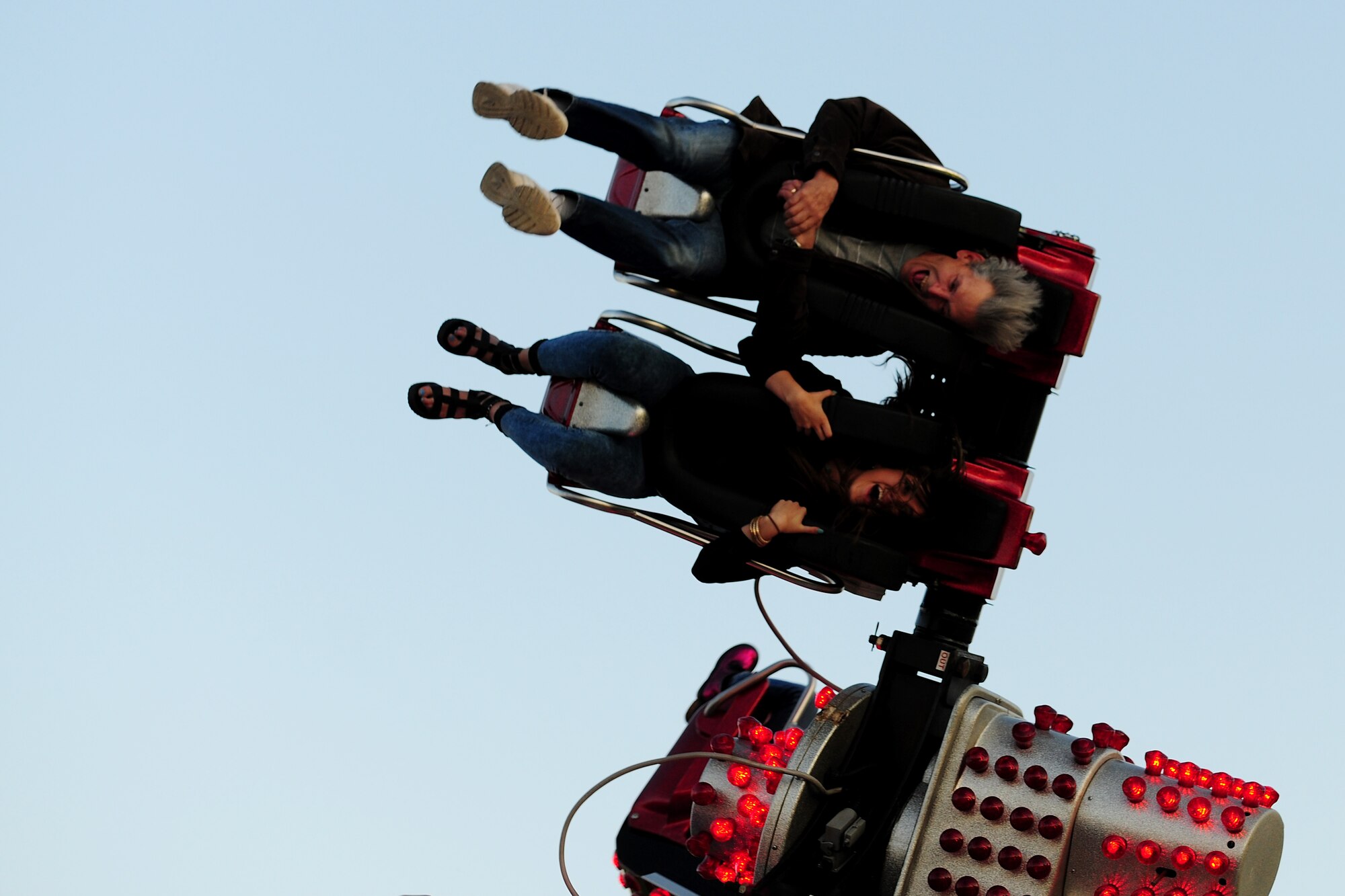 A couple screams while enjoying a ride during the Fourth of July celebration at RAF Alconbury, United Kingdom, July 3, 2014. The 501st Combat Support Wing celebrated Independence Day by opening the base to military and local community families. (U.S. Air Force photo by Staff Sgt. Jarad A. Denton/Released)