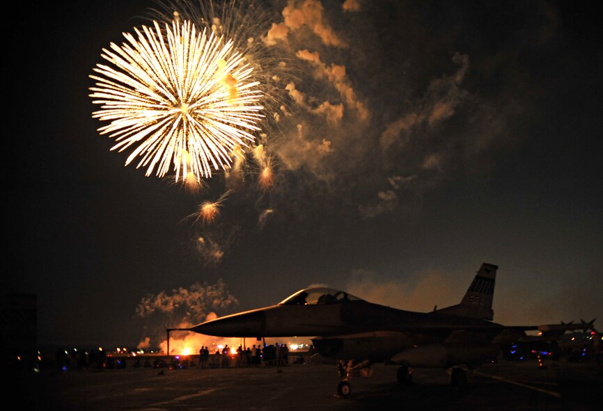 Fireworks light up the silhouette of an F-16 Fighting Falcon during Liberty Fest at Osan Air Base, Republic of Korea, July 4, 2014. Patriotic favorites made up the show’s soundtrack, including “Born in the U.S.A.” and “God Bless the U.S.A.” (U.S. Air Force photo/Airman 1st Class Ashley J. Thum)