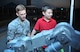 Staff Sgt. Andrew Trelly, 51st Civil Engineer Squadron explosive ordnance disposal team leader, helps Ty Mathis, 7, operate an EOD robot during Liberty Fest at Osan Air Base, Republic of Korea, July 4, 2014. Several units hosted demonstrations throughout the night which ended with a fireworks display. (U.S. Air Force photo/Airman 1st Class Ashley J. Thum)