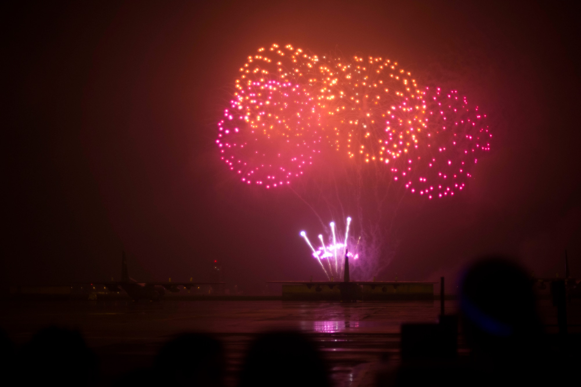 Fireworks explode over Yokota Air Base, Japan, during the annual Celebrate America event July 4, 2014. A performance by Slippery When Wet and fireworks ended the night after a patriotic day of activites. (U.S. Air Force photo by Staff Sgt. Chad C. Strohmeyer/Released)
