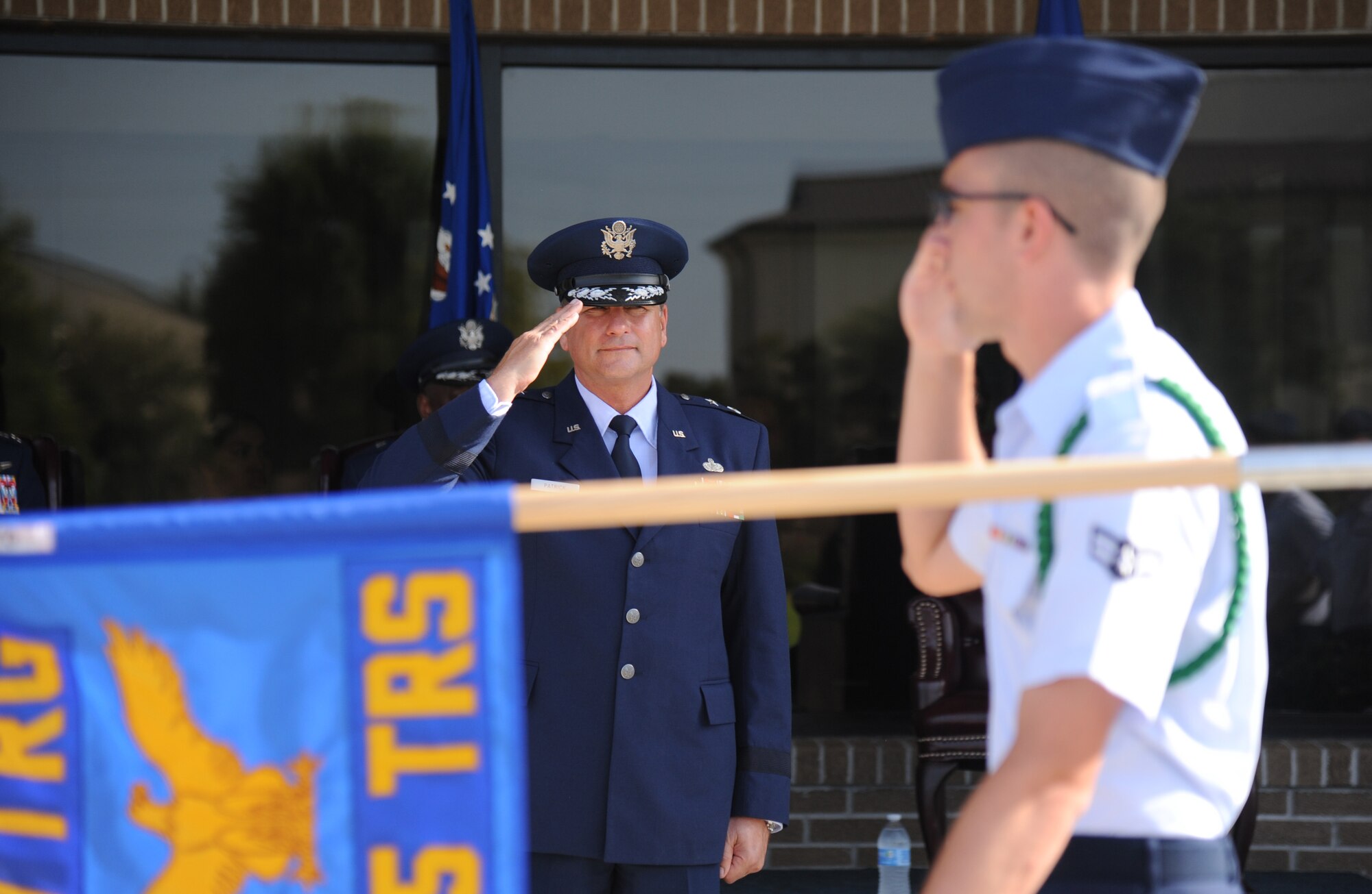 Maj. Gen. Leonard Patrick, outgoing 2nd Air Force commander, renders a salute as troops march during pass and review following the 2nd Air Force change of command ceremony July 3, 2014, at Keesler Air Force Base, Miss.  Patrick is replaced by Brig. Gen. Mark Brown was previously the Financial Management director, Headquarters Air Force Material Command at Wright-Patterson Air Force Base, Ohio. (U.S. Air Force photo by Kemberly Groue)