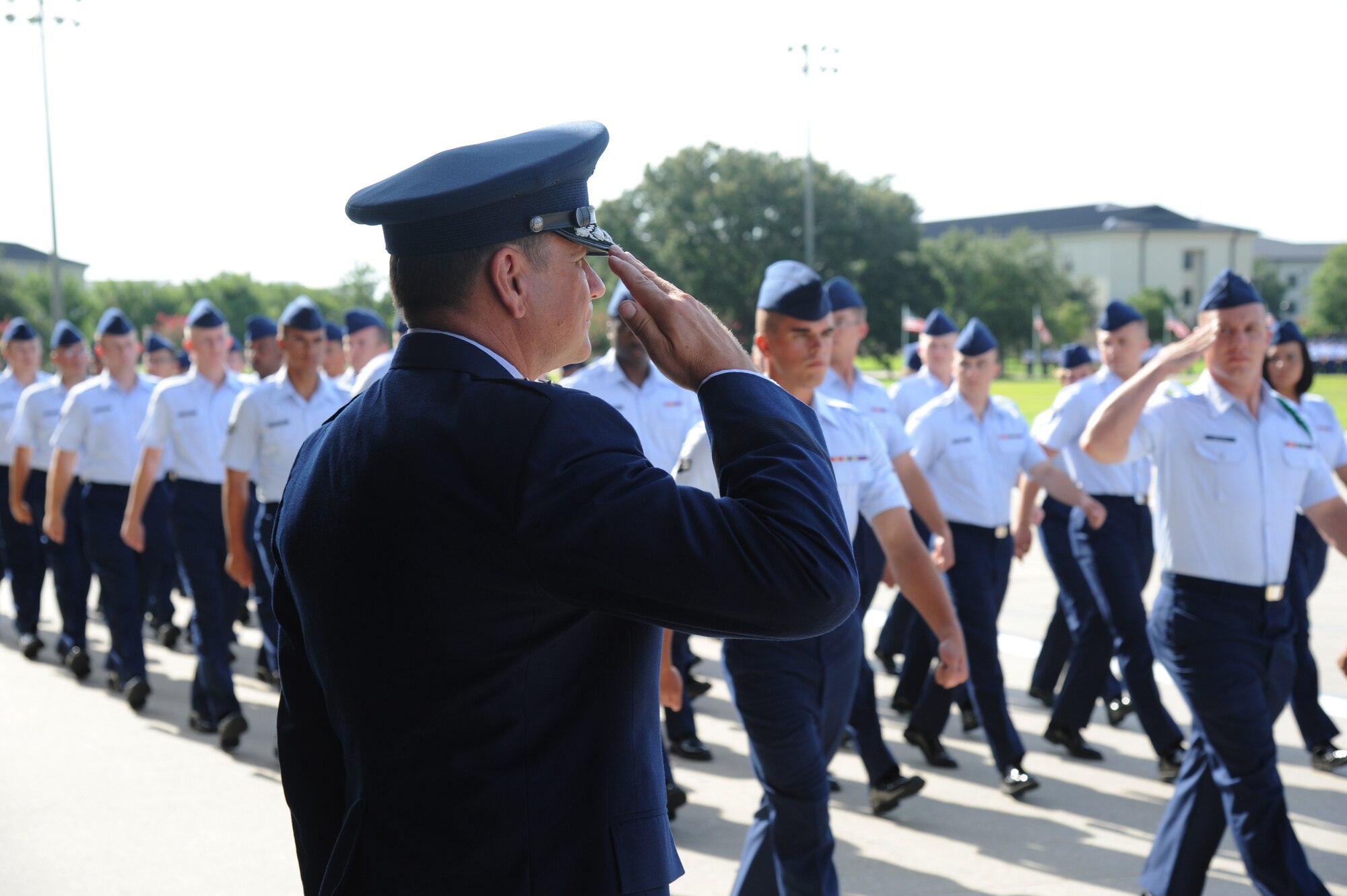 Maj. Gen. Leonard Patrick, outgoing 2nd Air Force commander, renders a salute as troops march during pass and review following the 2nd Air Force change of command ceremony July 3, 2014, at Keesler Air Force Base, Miss.  Patrick is replaced by Brig. Gen. Mark Brown was previously the Financial Management director, Headquarters Air Force Material Command at Wright-Patterson Air Force Base, Ohio. (U.S. Air Force photo by Kemberly Groue)