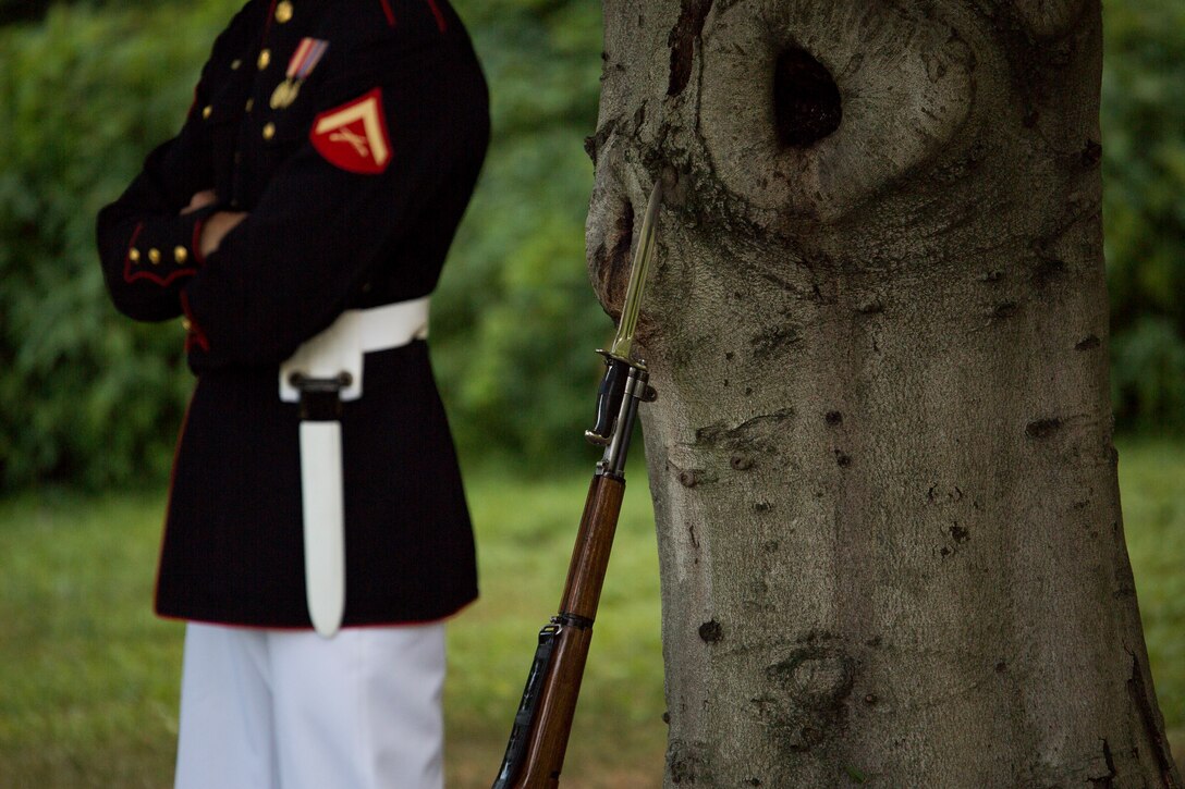 A member of the U.S. Marine Corps Silent Drill Platoon stands by prior to a Tuesday Sunset Parade at the Marine Corps War Memorial, July 8, 2014. The SDP was not able to perform due to inclement weather. (Official Marine Corps photo by Cpl. Dan Hosack/Released)