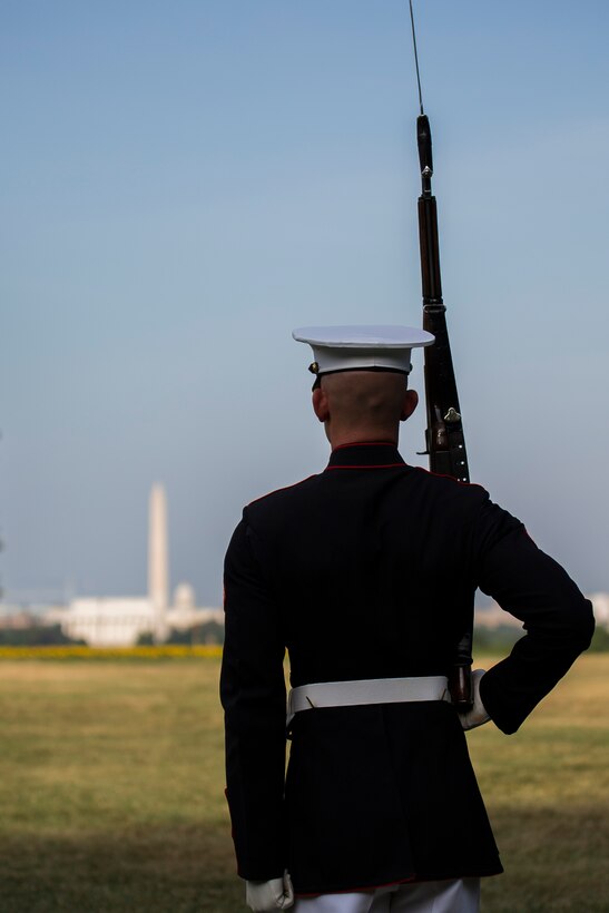 A member of the U.S. Marine Corps Silent Drill Platoon practices prior to a Tuesday Sunset Parade at the Marine Corps War Memorial, July 8, 2014. The SDP was not able to perform due to inclement weather. (Official Marine Corps photo by Cpl. Dan Hosack/Released)