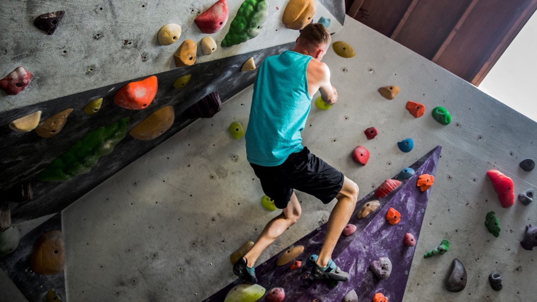 Corporal Tyler Bukoski, computer maintainer, 15th Marine Expeditionary Unit, maneuvers, parallel to the floor, along a wall at a rock climbing gym in Carlsbad, Calif., June 27, 2014. Bukoski, 22, is from Wanaque, New Jersey. (U.S. Marine Corps photo by Cpl. Emmanuel Ramos/Released)