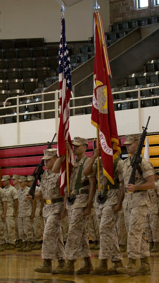 U.S. Marines assigned to the 26th Marine Expeditionary Unit (MEU) present the colors during the unit’s change of command ceremony aboard Camp Lejeune, N.C., June 25, 2014. Col. Matthew G. St. Clair relinquished command of the 26th MEU to Col. Robert C. Fulford. (U.S. Marine Corps Photo by Lance Cpl. Joshua W. Brown, 26th MEU Public Affairs/ Released)