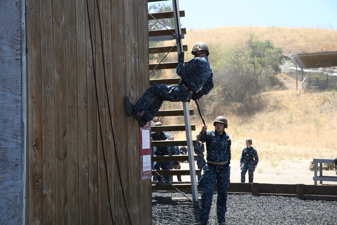 Midshipmen with 1st Platoon, 2nd Block, Company F, rappel during Professional Training for Midshipmen Marine Week aboard Marine Corps Base Camp Pendleton, Calif., July 1, 2014. The PROTRAMID program allows midshipmen to rotate through four week-long evolutions with each different service community in the Navy during their sophomore summer at the Naval Academy. Marine week introduces the midshipmen to Marine Corps culture, history and training. (U.S. Marine Corps photo by Cpl. Anna Albrecht)