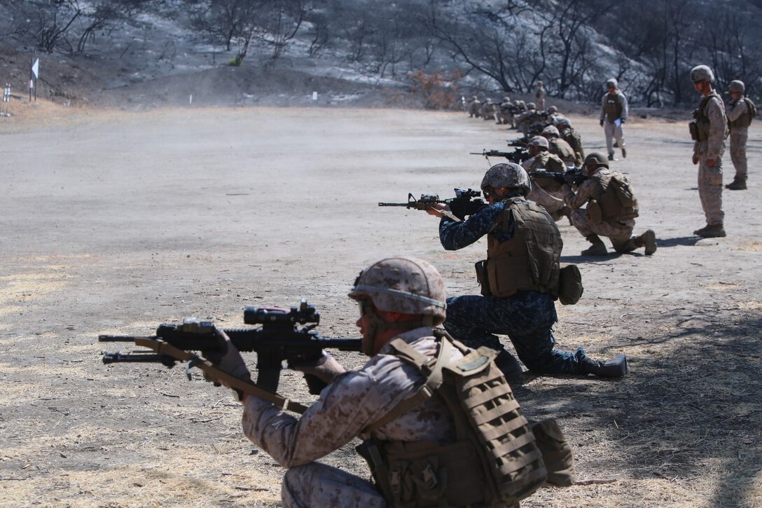 Midshipman Matt Metzdorff, 20, from Waseca, Minn., a junior at the United States Naval Academy, shoots with Company G, 2nd Battalion, 5th Marine Regiment aboard Marine Corps Base Camp Pendleton, Calif., June 30, 2014. Metzdorff is with Company G for a summer internship program where he is shadowing a Marine Corps officer to learn about the paths he could take after he graduates.