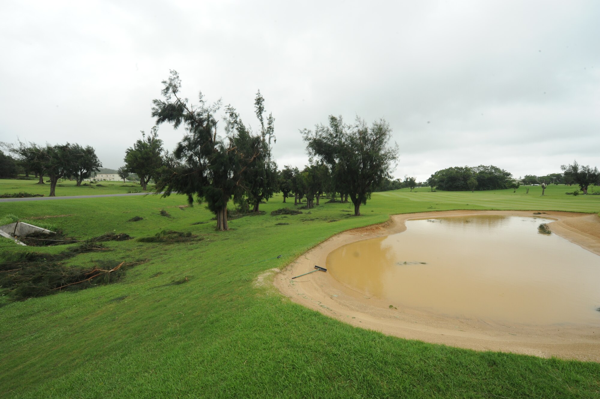 Trees were damaged and sand traps flooded on the golf course by typhoon Neoguri on Kadena Air Base, Japan, July 10, 2014. The typhoon blew over hundreds of trees all around base and left many without power.  (U.S. Air Force photo by Airman 1st Class Stephen G. Eigel)