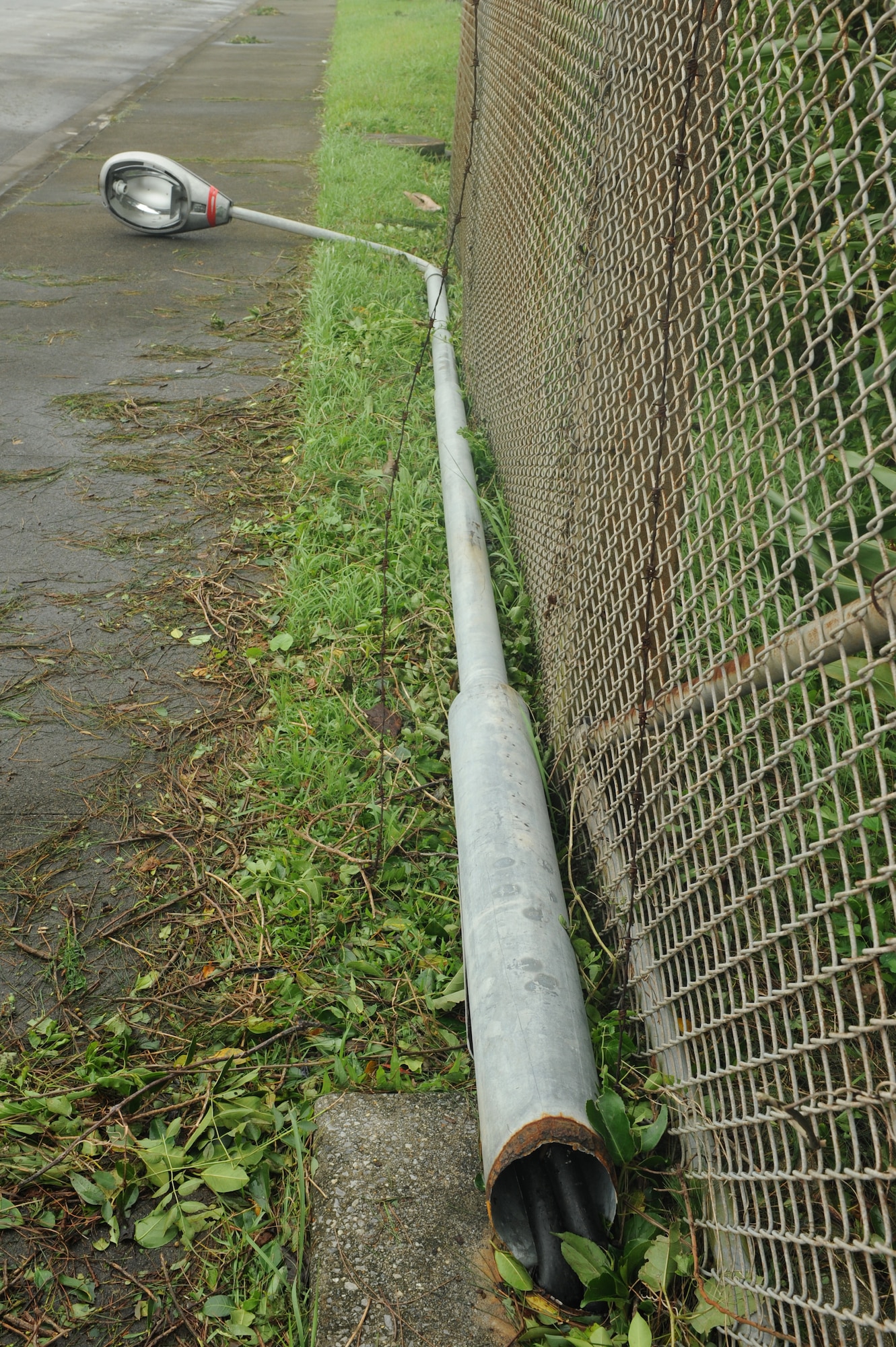Lamp posts were knocked over by strong winds during the typhoon on Kadena Air Base, Japan, July 9, 2014. Typhoon Neoguri blew over trees, lamp posts, cars, and blew scaffolding off of buildings during its wrath over Okinawa. This typhoon was the first one to hit Kadena during the 2014 typhoon season. (U.S. Air Force photo by Airman 1st Class Stephen G. Eigel)
