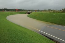 The only road leading to and from the 18th Munitions Squadron flooded in the wake of Typhoon Neoguri on Kadena Air Base, Japan, July 9, 2014. This typhoon was the first one to hit Kadena during the 2014 typhoon season and left many areas flooded and without power. (U.S. Air Force photo by Airman 1st Class Stephen G. Eigel)