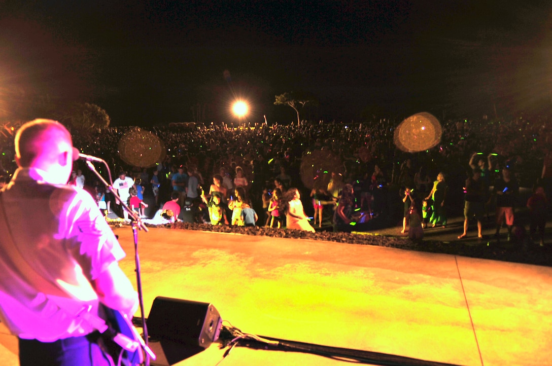 WAIKOLOA, Hawaii –SSgt Aaron Kusterer (guitar), Band of the Pacific-Hawaii, solos during “Living in America” during the annual Waikoloa Bowl “Family Fourth and Fireworks” celebration. “Hana Hou!” played a patriotic closer, which was synced up to the ornate fireworks display. After the patriotic closer, the audience was chanting “U.S.A”! (US Air Force Photo/ TSgt Michael Smith/released)