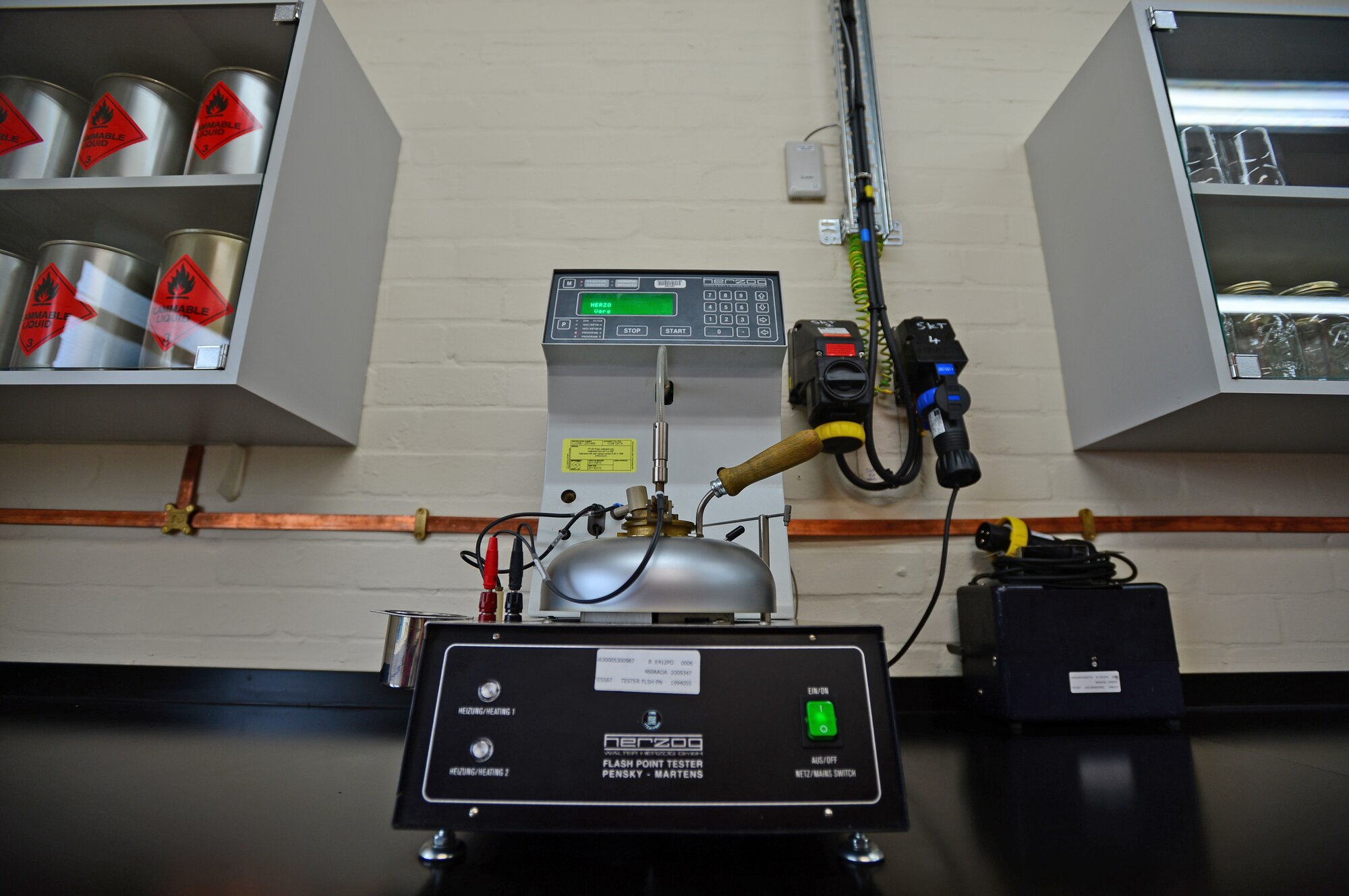 The 48th Civil Engineer Squadron renovated a new fuels laboratory for the 48th Logistics Readiness Squadron fuels management flight, which was marked by a ribbon-cutting ceremony at Royal Air Force Lakenheath, England, June 27, 2014. The original estimate for the new fuels laboratory was projected at a $750,000 contract, but the overall cost was reduced by 90 percent. (U.S. Air Force photo by Airman 1st Class Erin O’Shea/Released) 