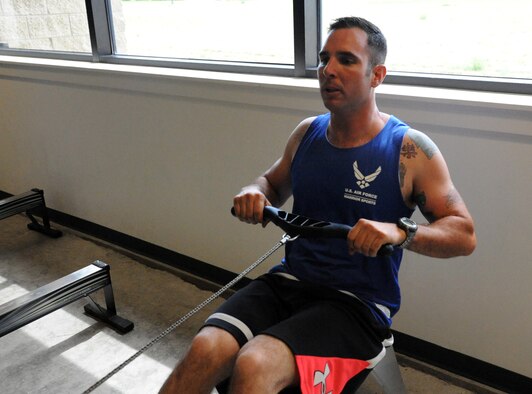 Staff Sgt. Christopher D’Angelo, 819th RED HORSE Squadron heavy equipment operator, exercises on a row machine at the Malmstrom Air Force Base Fitness Center July 9. D’Angelo will be participating in the 2014 Invictus Games in September. (U.S. Air Force photo/Airman 1st Class Joshua Smoot)
