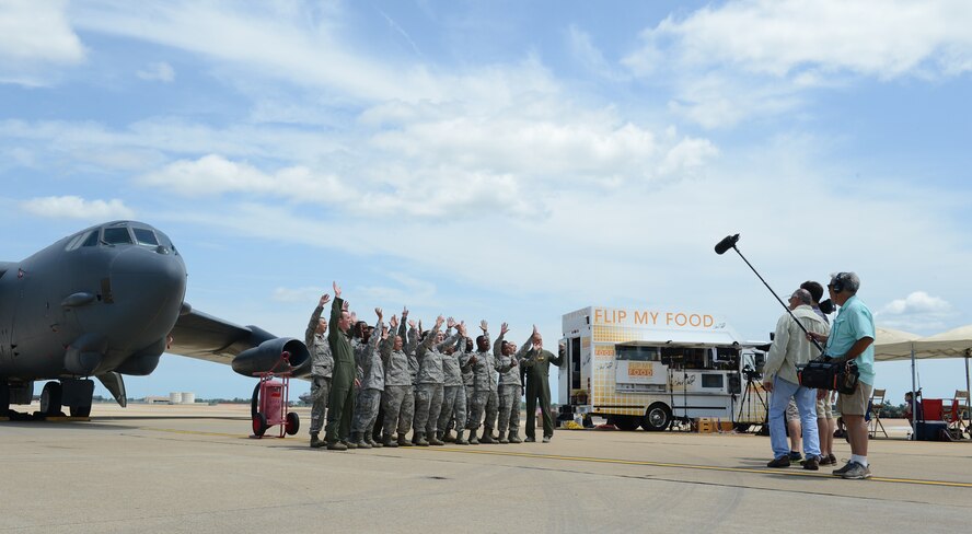 Barksdale Airmen cheer during a taping of Flip My Food with Chef Jeff Henderson on Barksdale Air Force Base, La., July 9, 2014. Flip My Food visited Barksdale to cook meals for Barksdale Airmen and show their appreciation for the military. (U.S. Air Force photo/Senior Airman Benjamin Gonsier)
