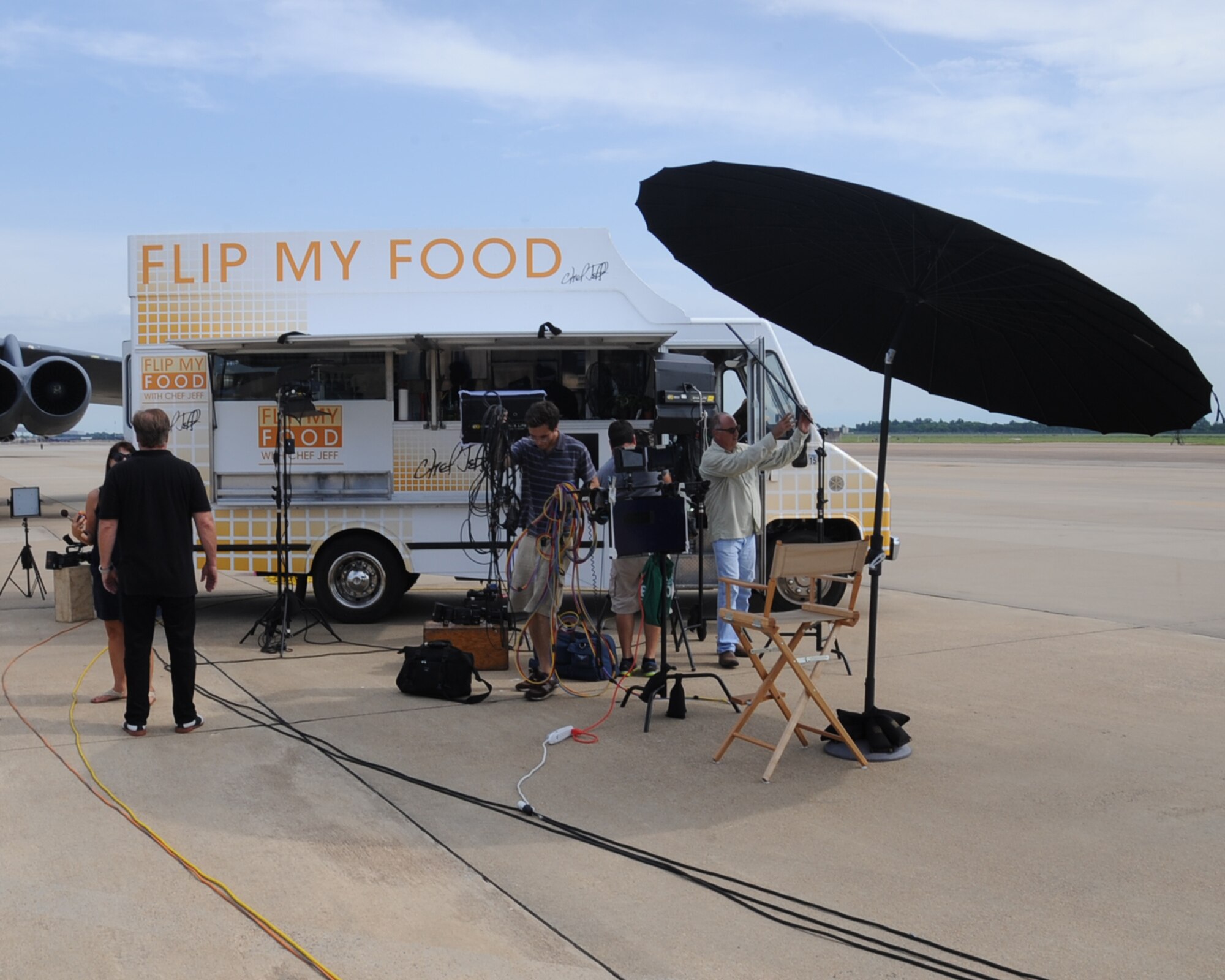 The crew from Flip My Food sets up for a taping on Barksdale Air Force Base, La., July 9, 2014. The show came to Barksdale to show Airmen a healthier way of cooking everyday meals. (U.S. Air Force photo/Staff Sgt. Sean Martin)

