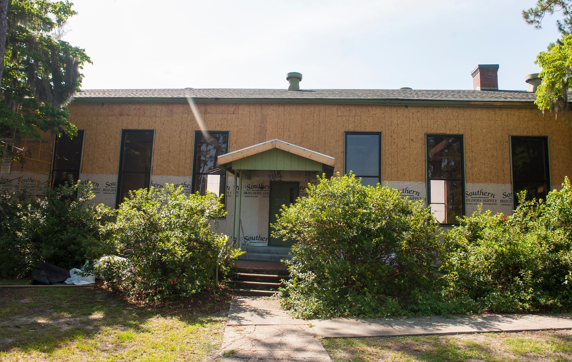 Contractors work to restore an old Moody Field Club building at Moody Air Force Base, Ga., June 1, 2014. The building has had many roles throughout the years including a Moody field club and child development center. (U.S. Air Force photo by Senior Airman Jarrod Grammel/Released) 
