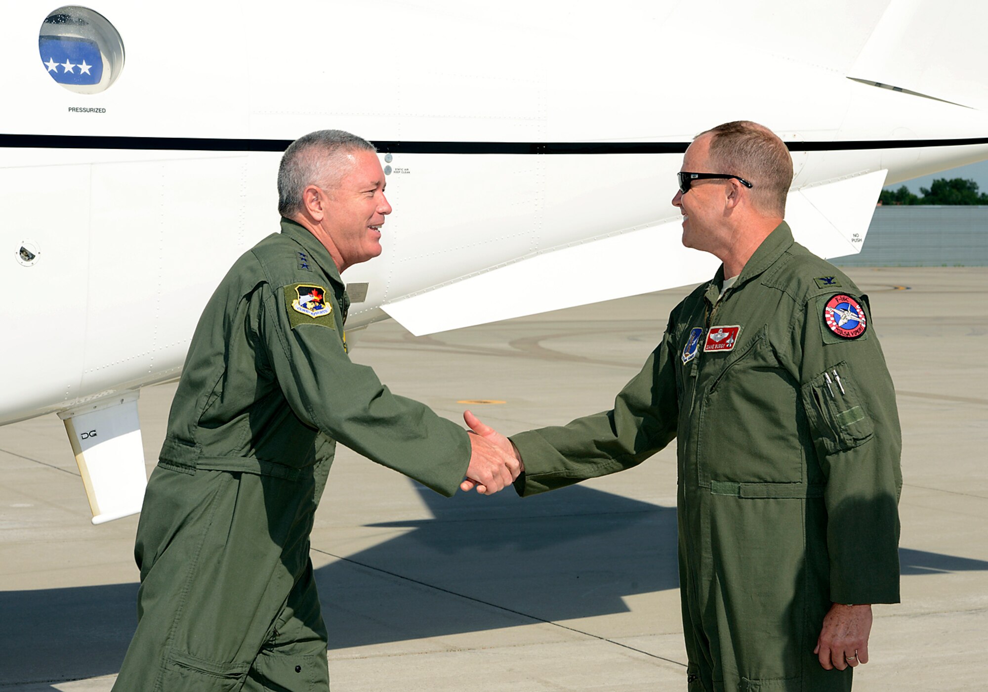 First Air Force Commander, Lt Gen William Etter, is greeted upon his arrival at the 138th Fighter Wing in Tulsa Okla., by Colonel David Burgy, 138th FW Commander, 24 June 2014. Etter stopped at the 138th for a brief visit and to fly a training mission with the F-16 pilots of the 125th Fighter Squadron. (U.S. National Guard photo by Senior Master Sgt. Preston L. Chasteen/Released)