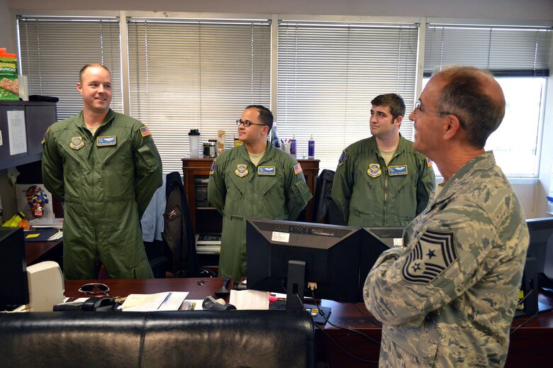 Staff Sgt. Michael Dunlap, 43rd Operations Support Squadron, left, briefs Joint Airdrop Inspection operations to Chief Master Sgt. Pete Stone, U.S. Air Force Expeditionary Center command chief, during his tour of 43rd Airlift Group units on July 8, 2014, Pope Army Airfield, N.C. (U.S. Air Force photo/Marvin Krause)