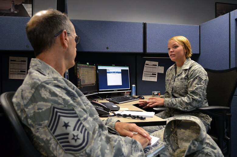 Chief Master Sgt. Pete Stone, U.S. Air Force Expeditionary Center command chief, discusses enlisted issues with Senior Airman Brooke Reinbeck, 43rd Comptroller Flight, during his tour of 43rd Airlift Group units on July 8, 2014, Pope Army Airfield, N.C. (U.S. Air Force photo/Marvin Krause)